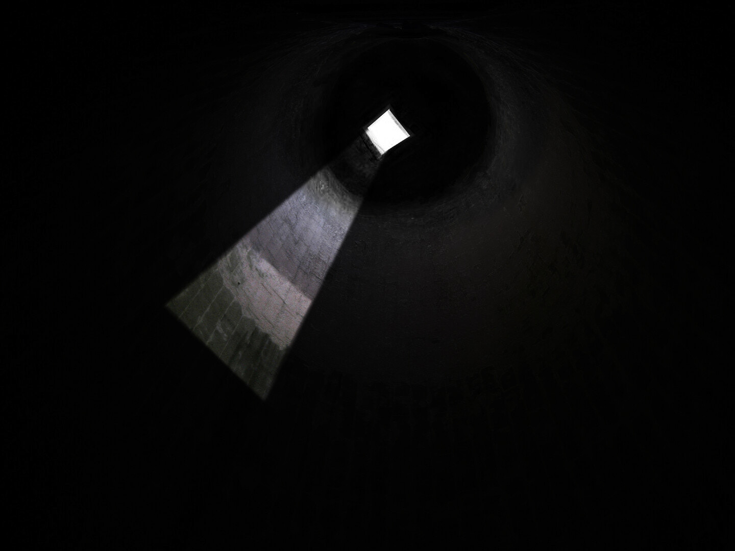 Looking up at cistern hole in daytime.
