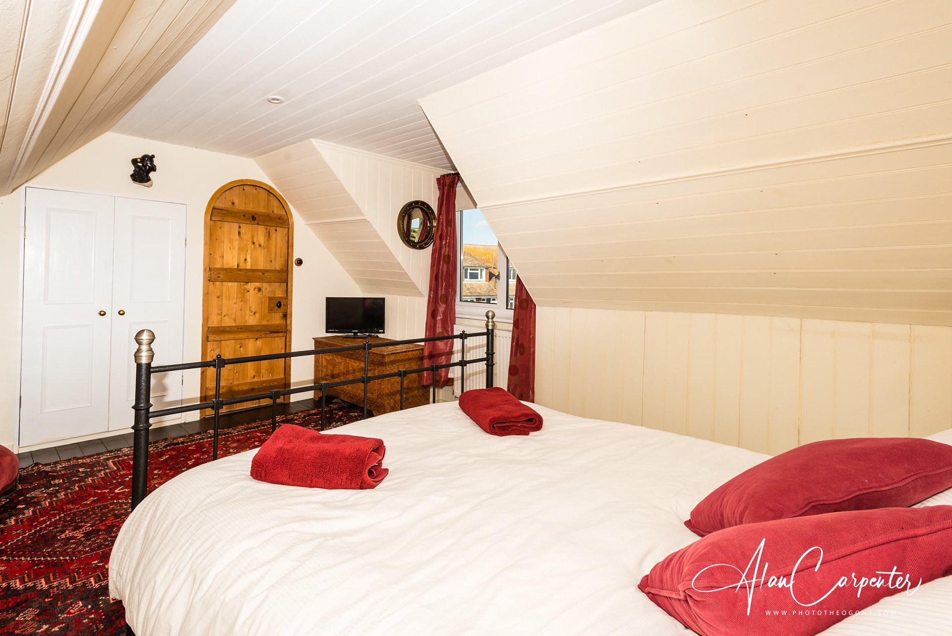 Characterful top-floor double under the eaves with ocean glimpses