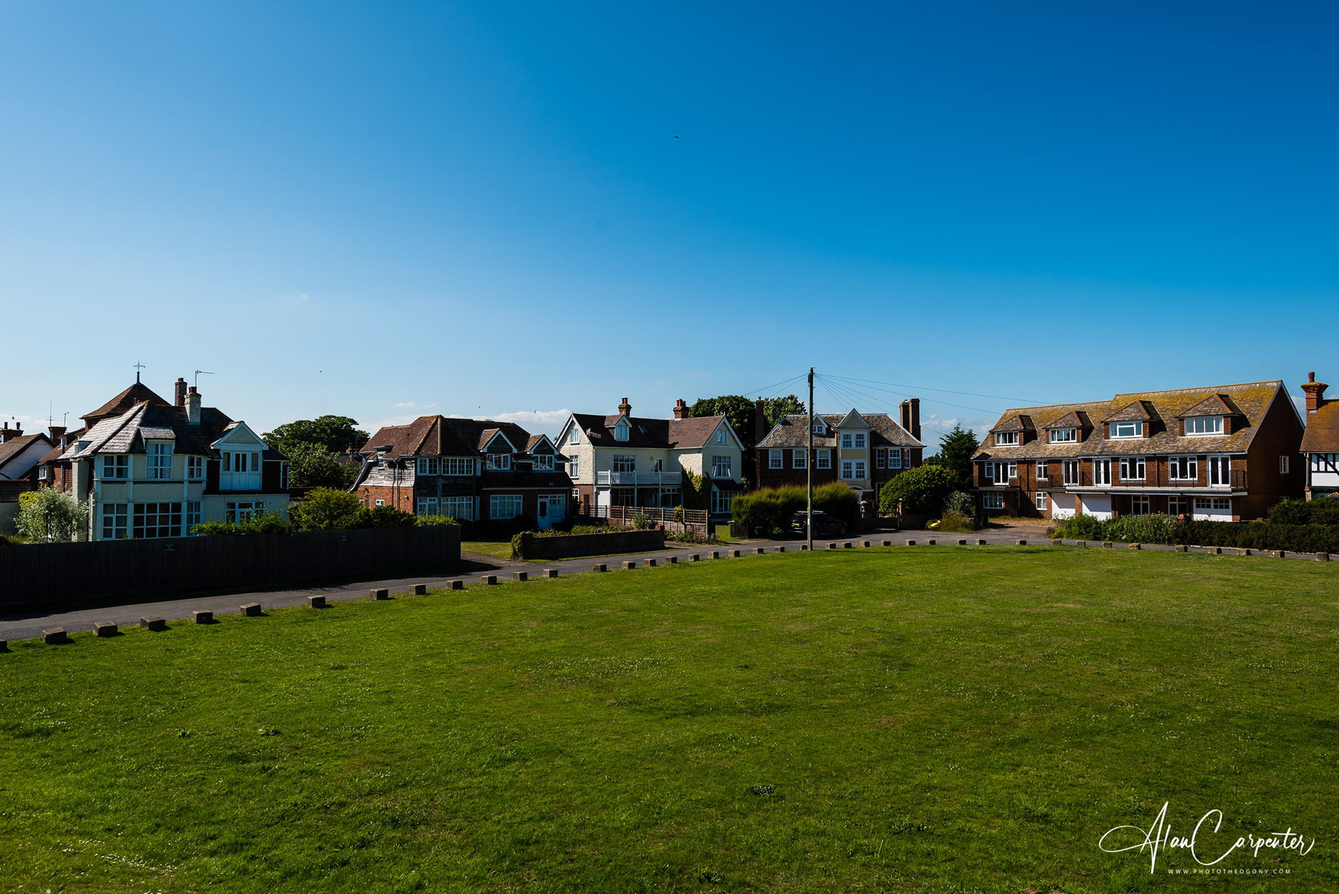 The private green between the beach and the house.