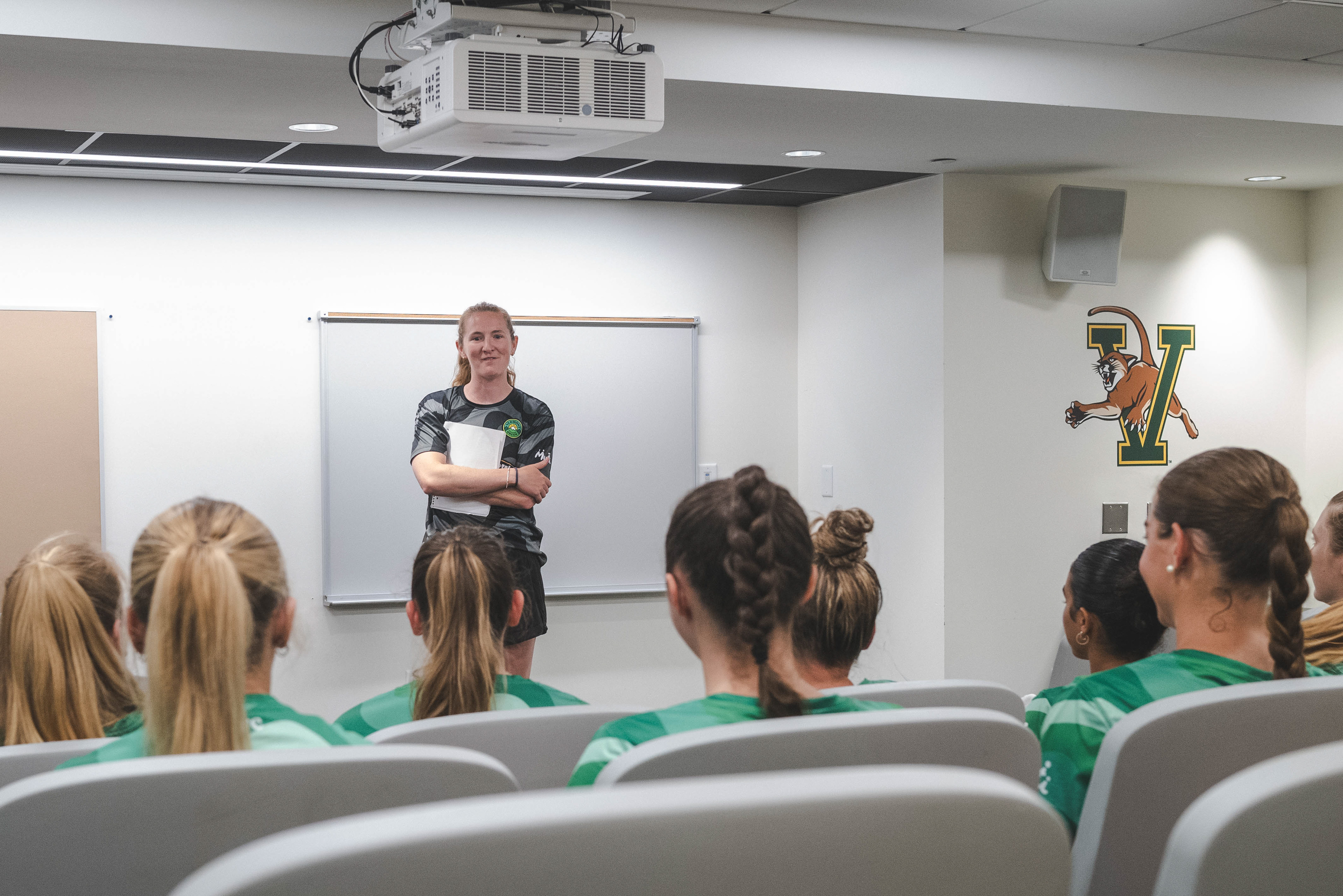 Coach Sam Lewis meets her new team. 