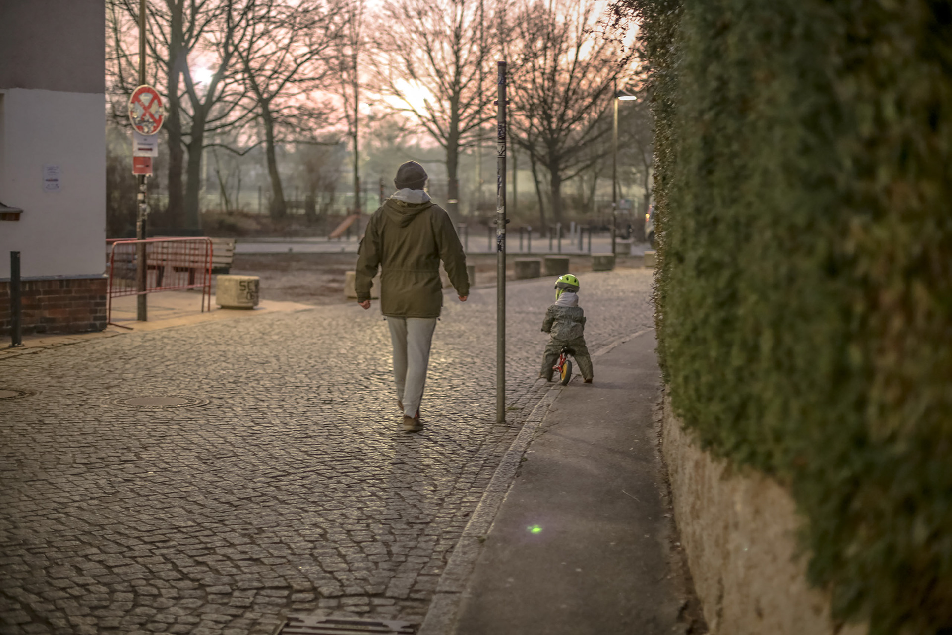 Man walking with his child. Family image. Family in Berlin walking. People phtography