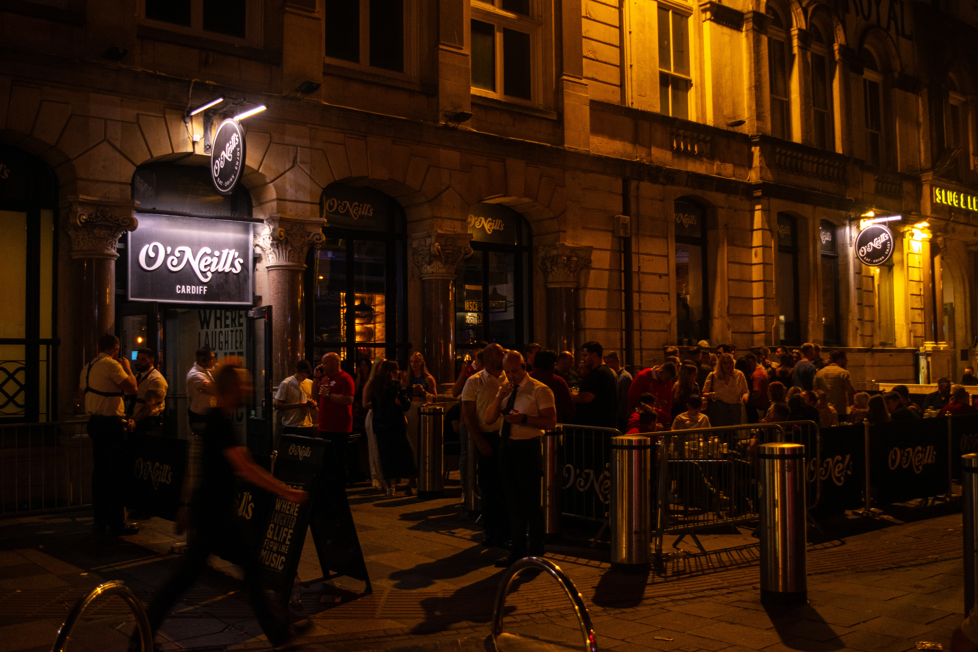People socialising at the outdoor section of the pub.