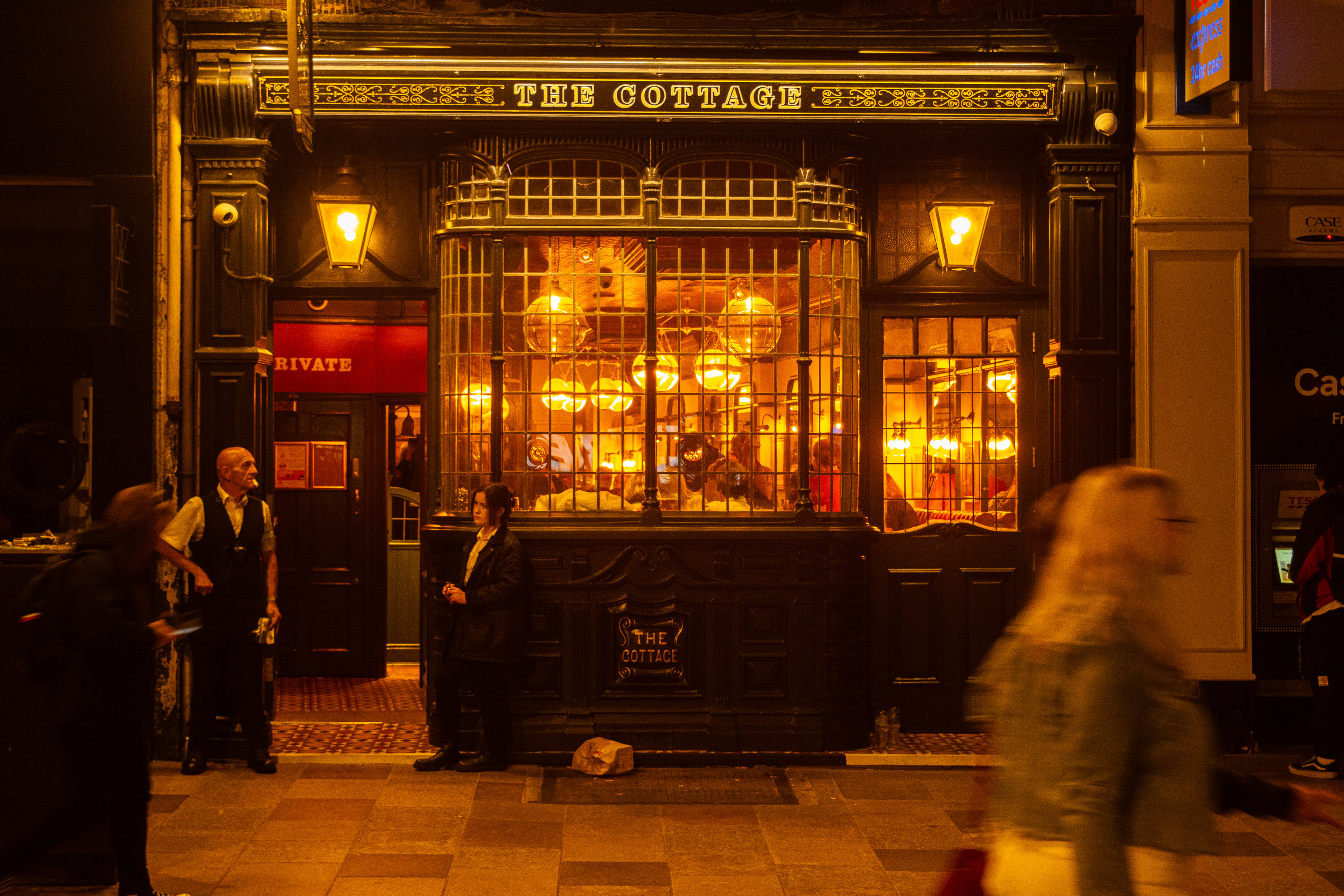 The security at the entrance of a pub.