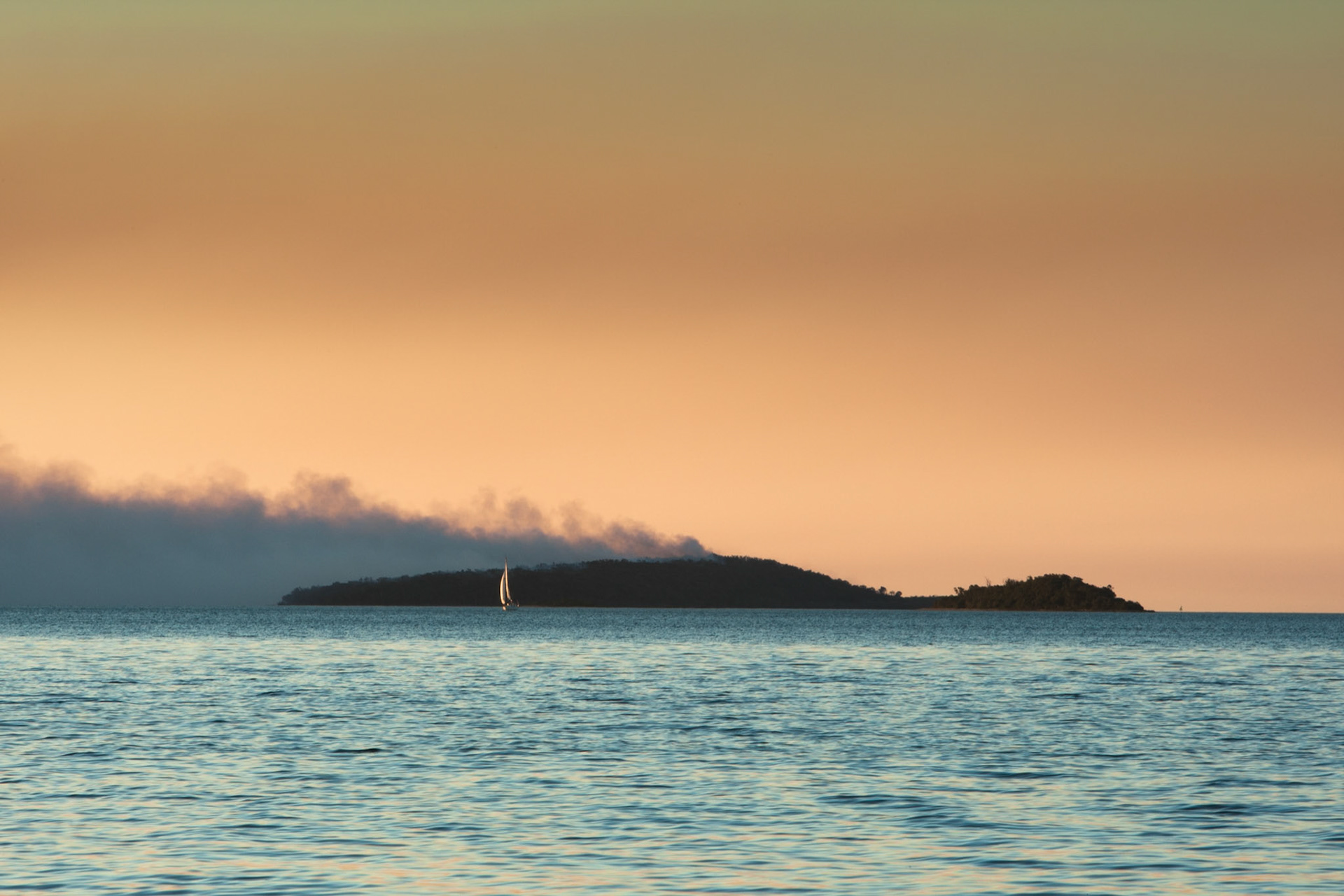 Sunset bushfire smoke on Woody Island in Hervey Bay, from Fraser Island.