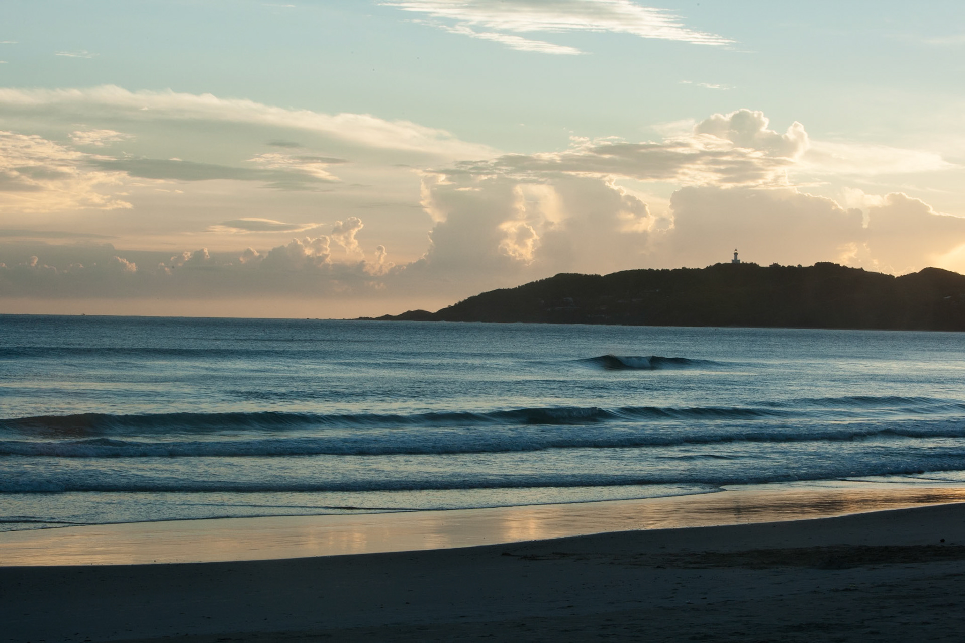Belongil beach and Cape Byron lighthouse