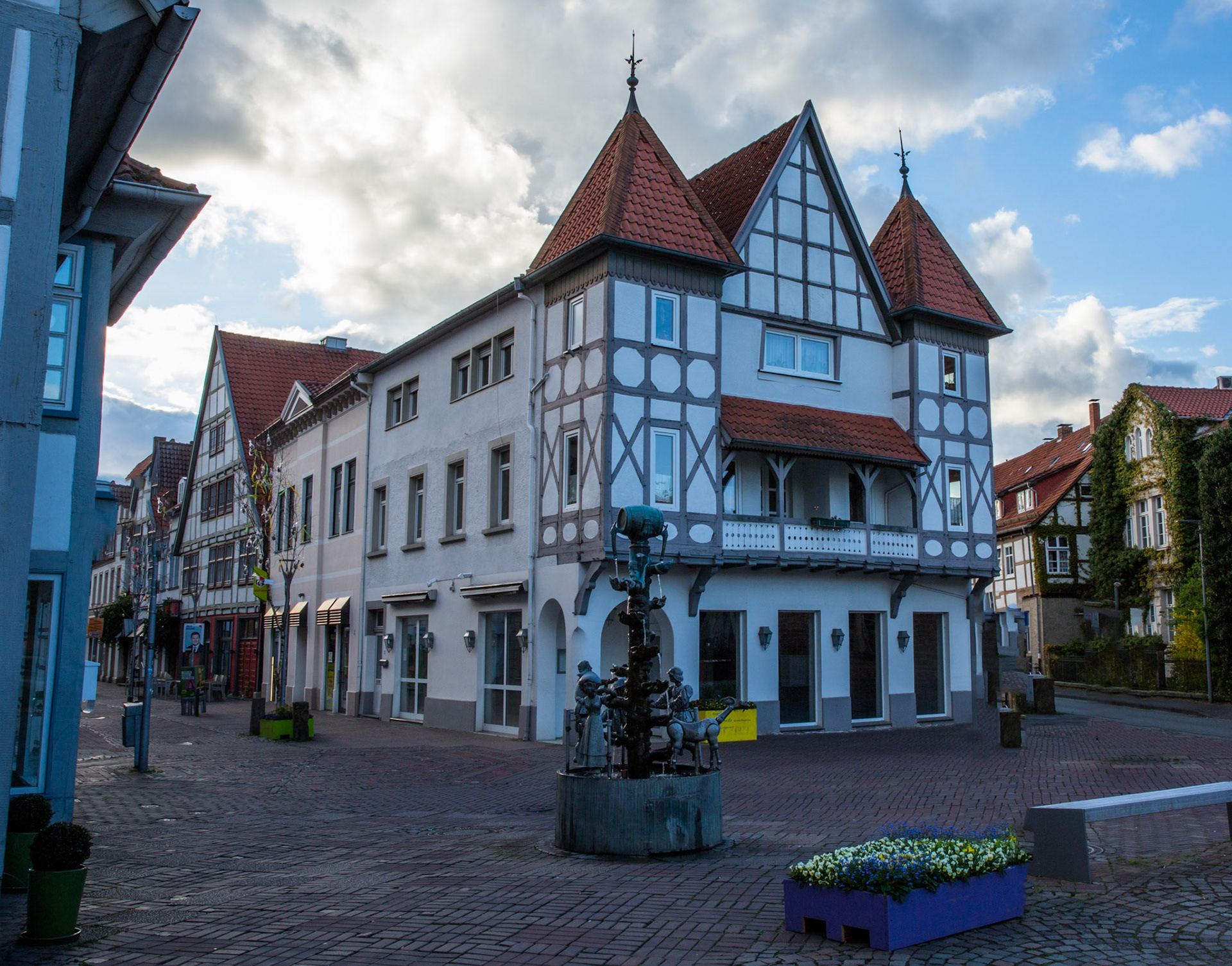 Kanzlerbrunnen, Chancellor Fountain, Lemgo. Built  to commemorate the beer wars in the 17th century following the introduction of a drinking tax. Adorned with a beer barrel and drinking faces. By Bonnifatius Stirnberg 1977.