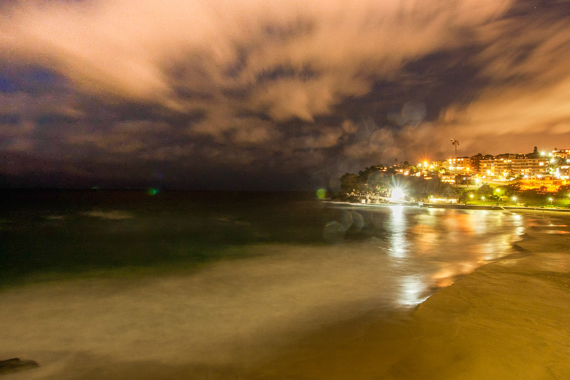 A night-time shot of Bronte Beach before a storm.
