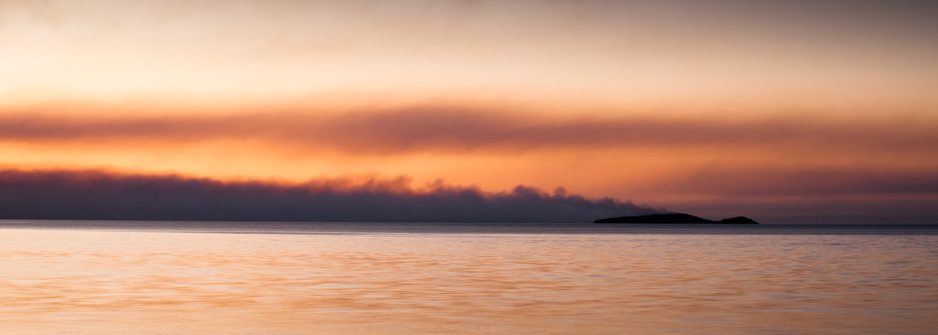 Sunset bushfire smoke on Woody Island in Hervey Bay, from Fraser Island.