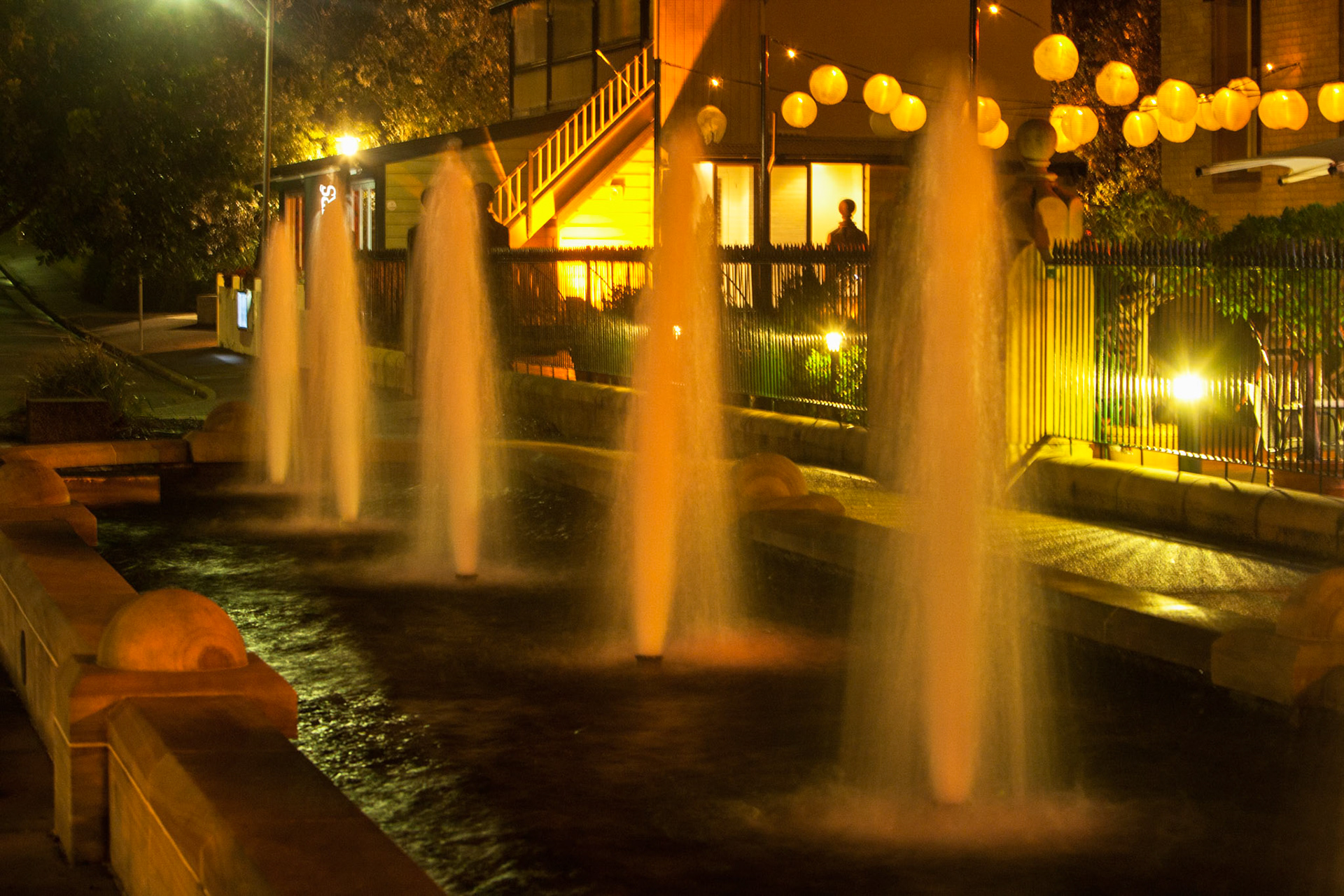An evening shot of the fountains outside the Customs House in Newcastle