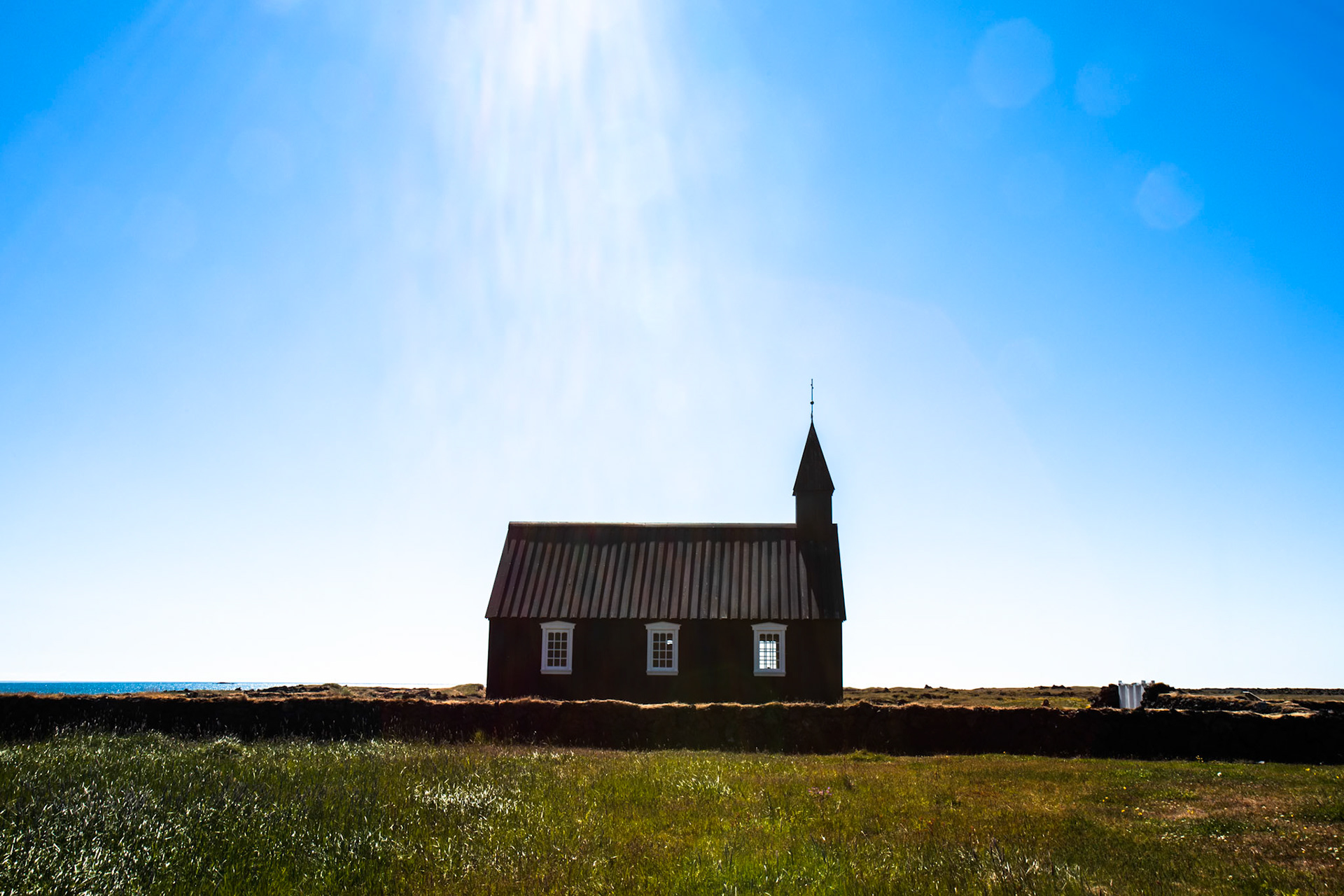 Church in Búdir, Snæfellsnes, Iceland. A church was originally built in Búdir in 1703. The church houses a bell dated 1672, an alterpiece 1750, a silver chalice and messing candlestick 1767 and a door ring 1703. The Búdir church is the oldest wooden church in Iceland