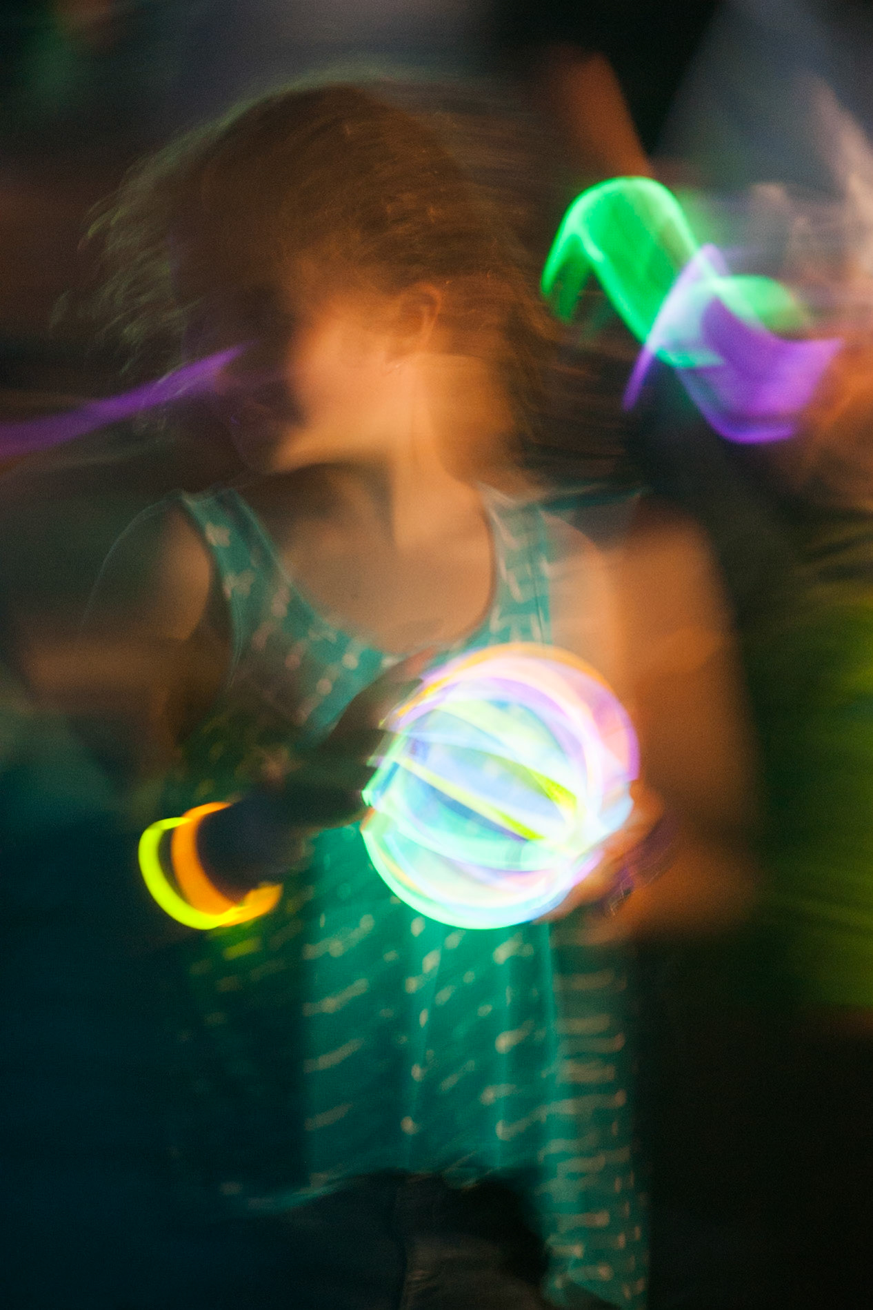 A young lady, lit by the light of a cylume, National Botanic Gardens, Sydney