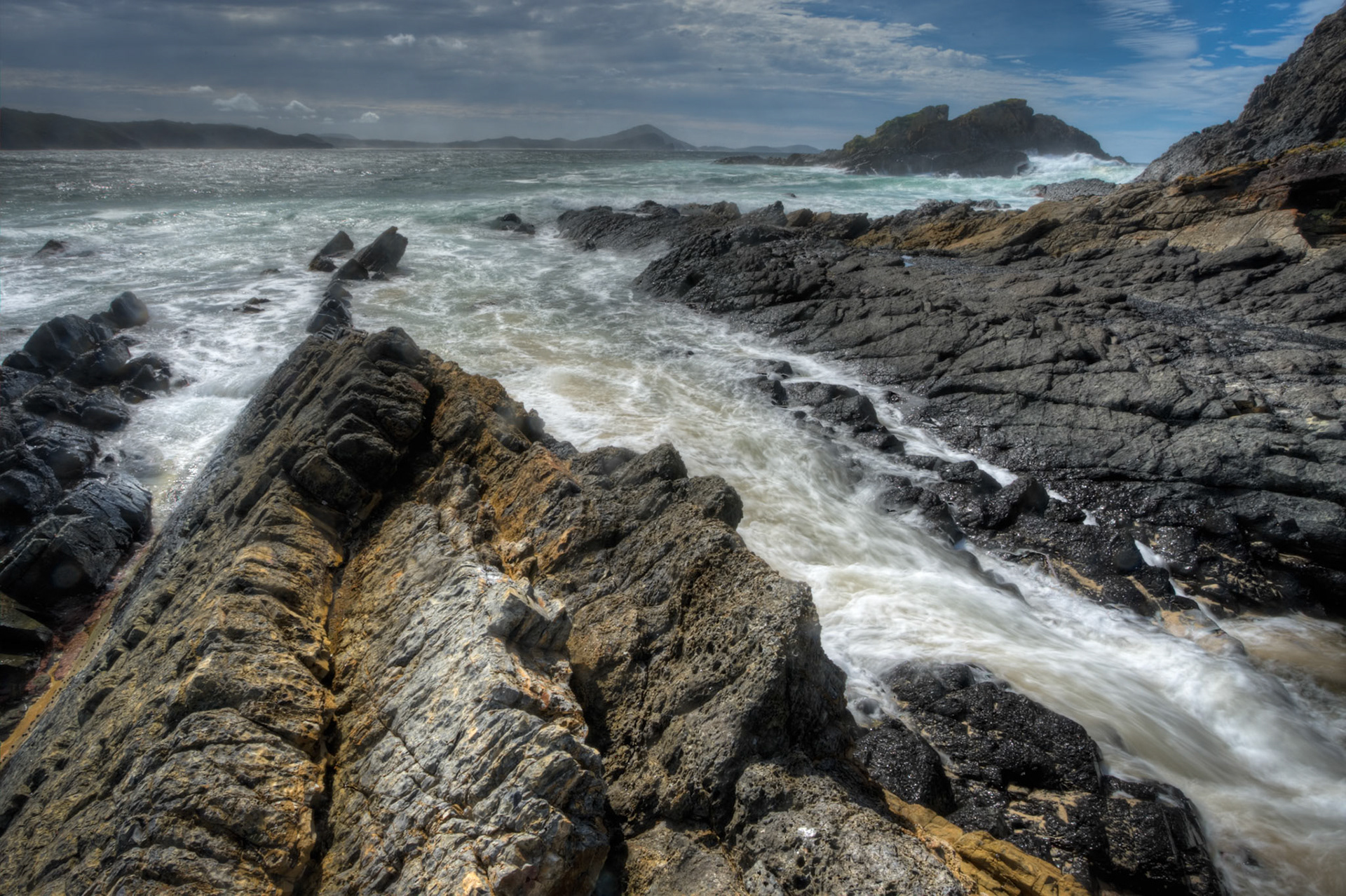 A high dynamic range (HDR) image of the rocks and sea at Seal Rocks, near Bluey's Beach New South Wales.