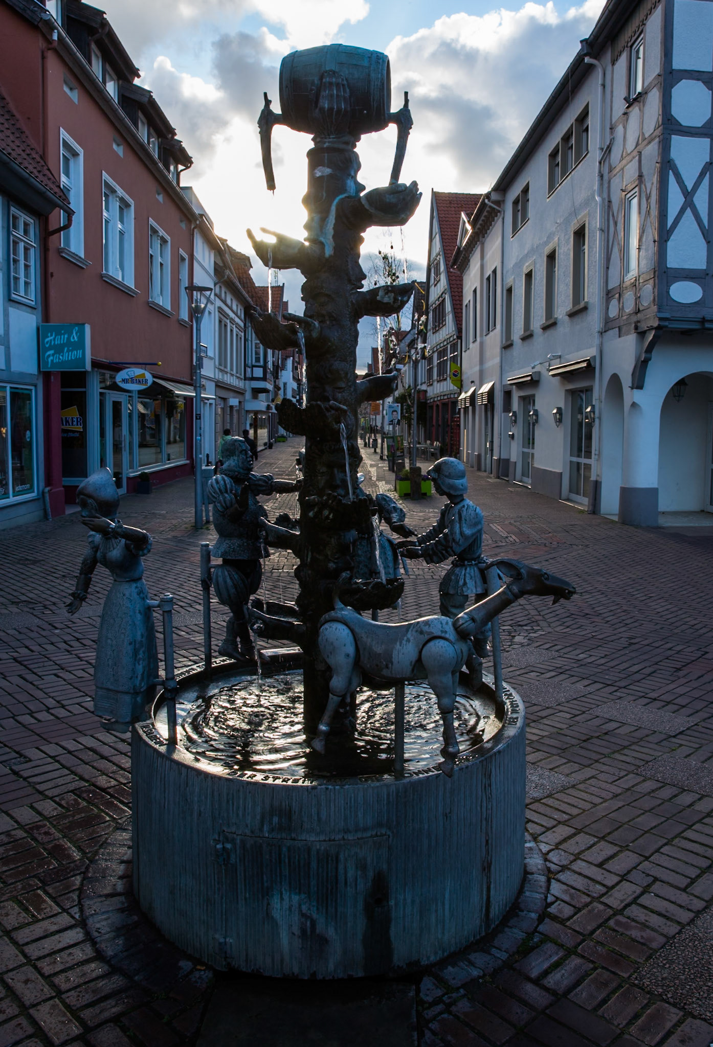 Kanzlerbrunnen, Chancellor Fountain, Lemgo. Built  to commemorate the beer wars in the 17th century following the introduction of a drinking tax. Adorned with a beer barrel and drinking faces. By Bonnifatius Stirnberg 1977.
