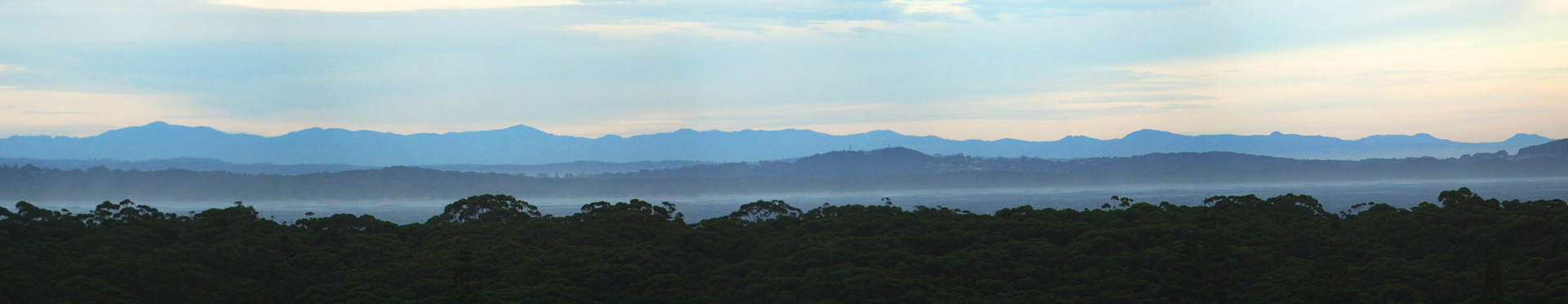 Late afternoon balcony view of tiered mountain ranges, Bluey's Beach.