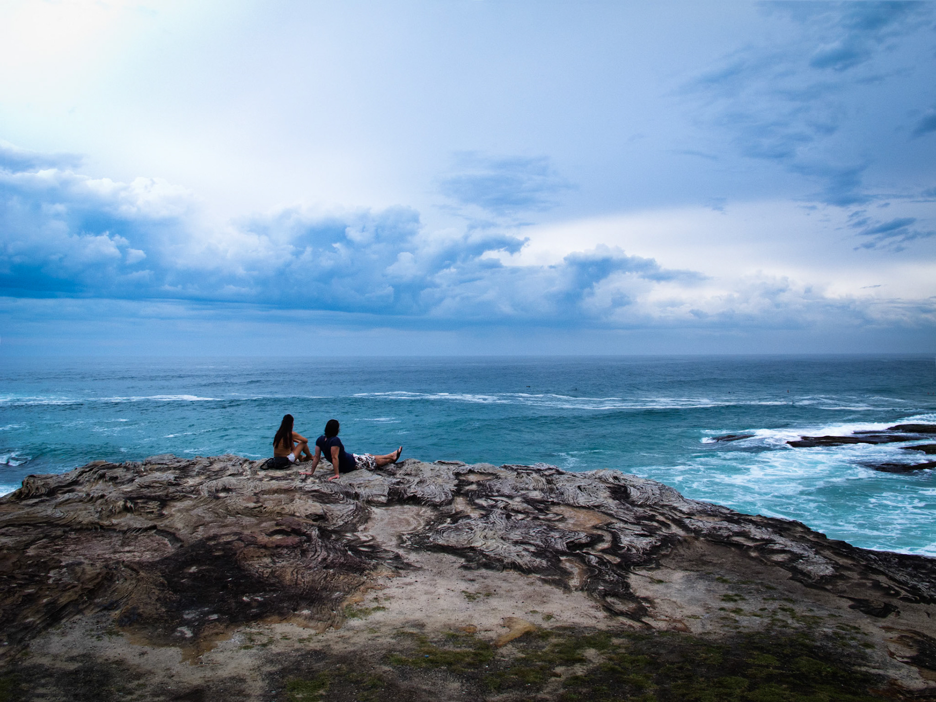 Couple overlooking the sea, Tamarama, Sydney, Australia
