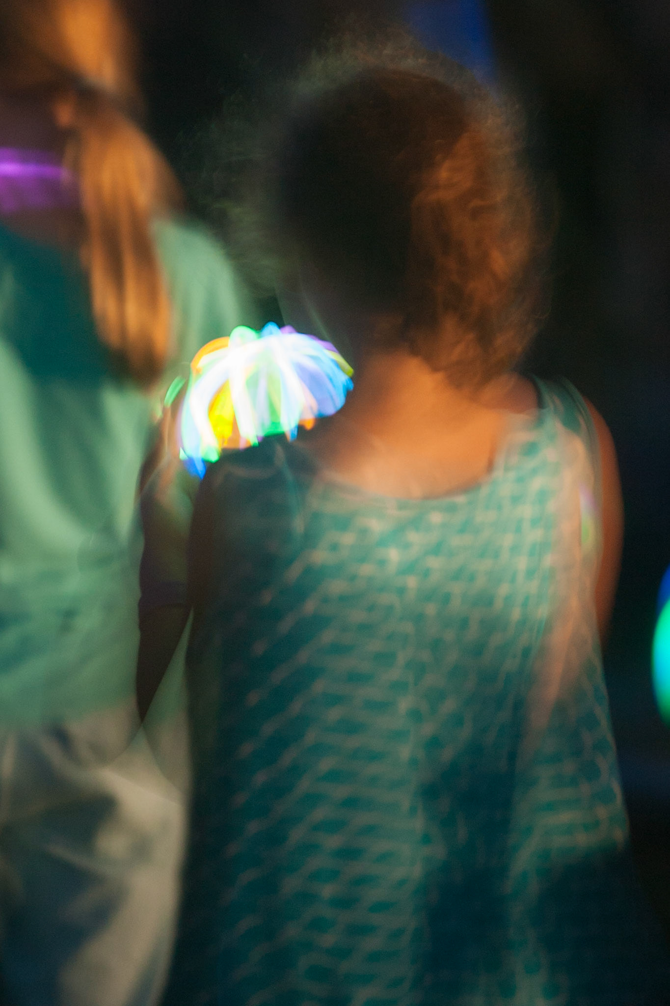 A young lady, lit by the light of a cylume, National Botanic Gardens, Sydney