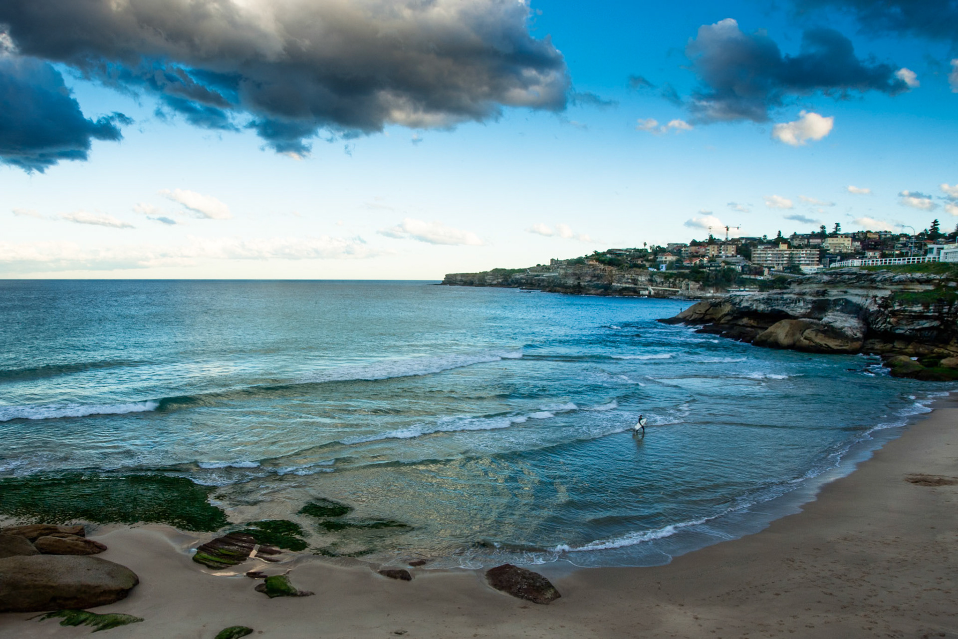 The last of the surfers to emerge from the sea before the sun finally disappears from the sky. Tamarama, Sydney