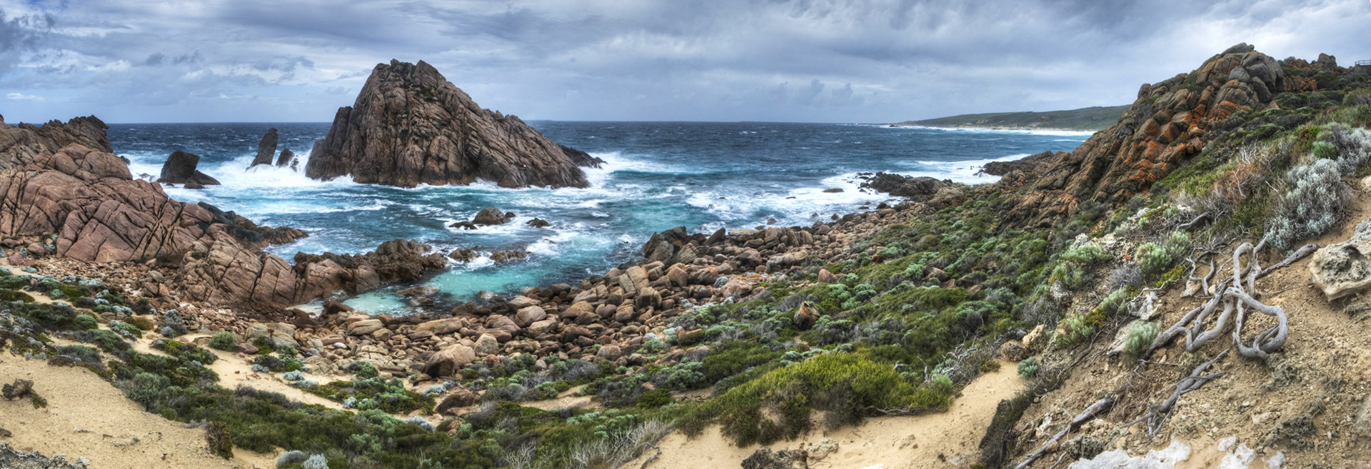 A high dynamic range panorama of Sugarloaf rock and wild seas. Sal thought i was never coming back.