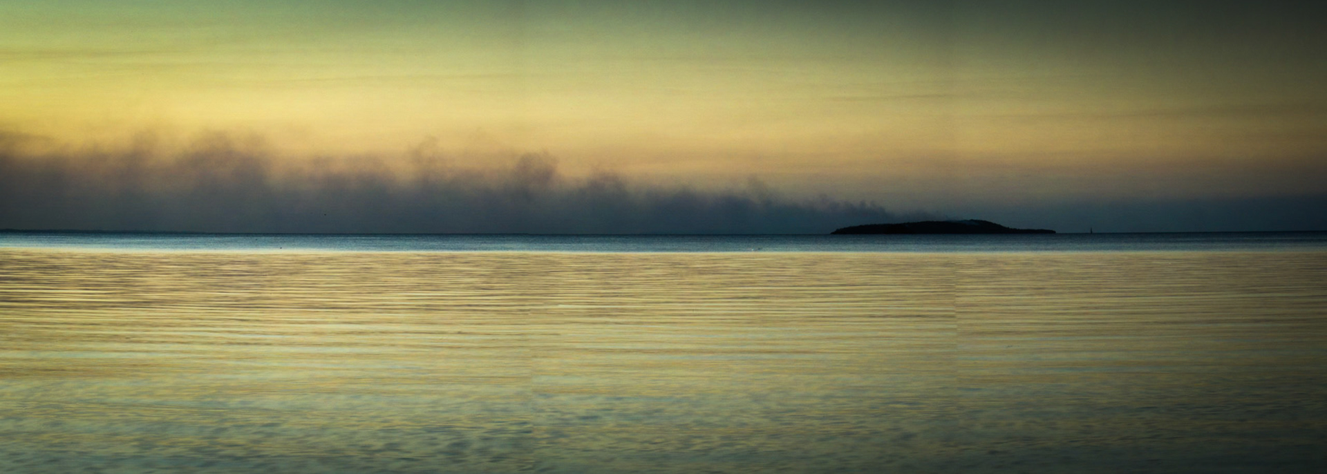Sunset bushfire smoke on Woody Island in Hervey Bay, from Fraser Island.