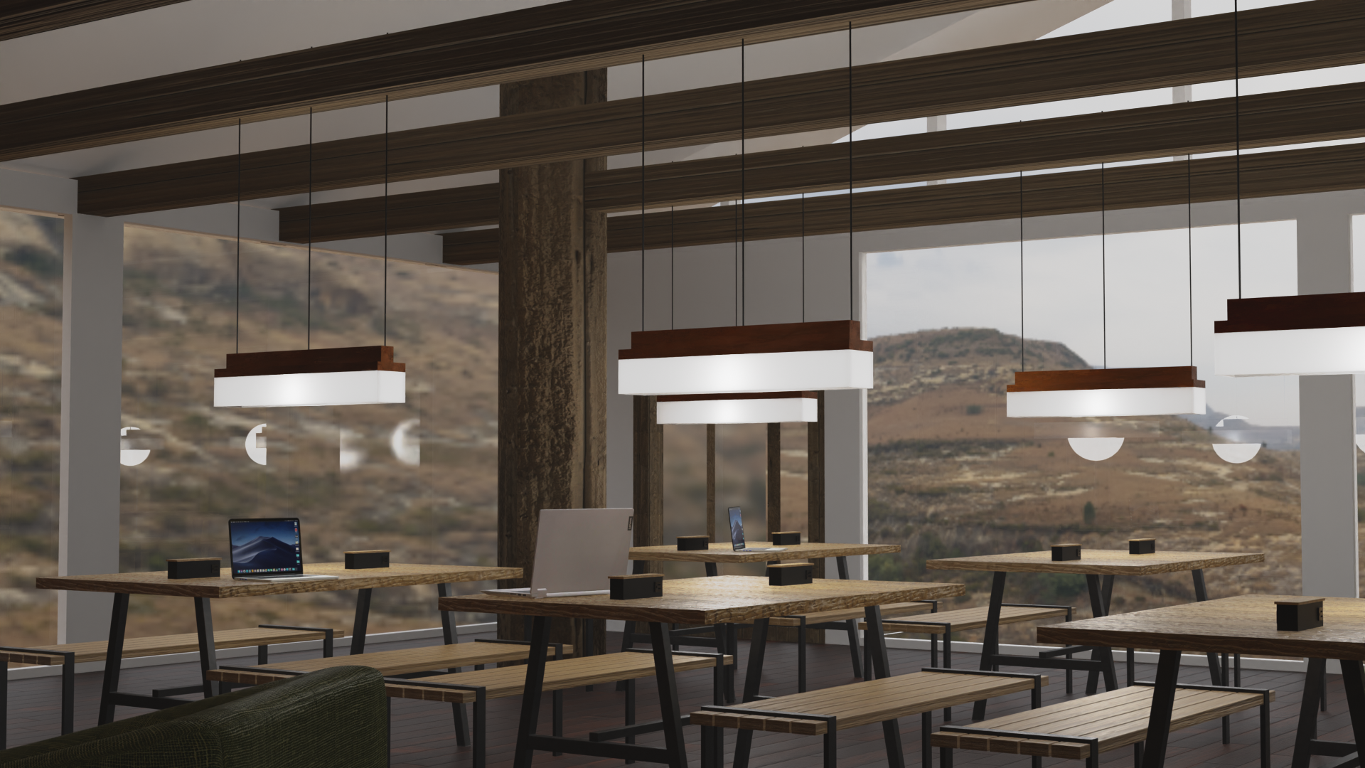 The main space is designed to support collaboration. It features a communal kitchen, a shared workspace, and a central fireplace.