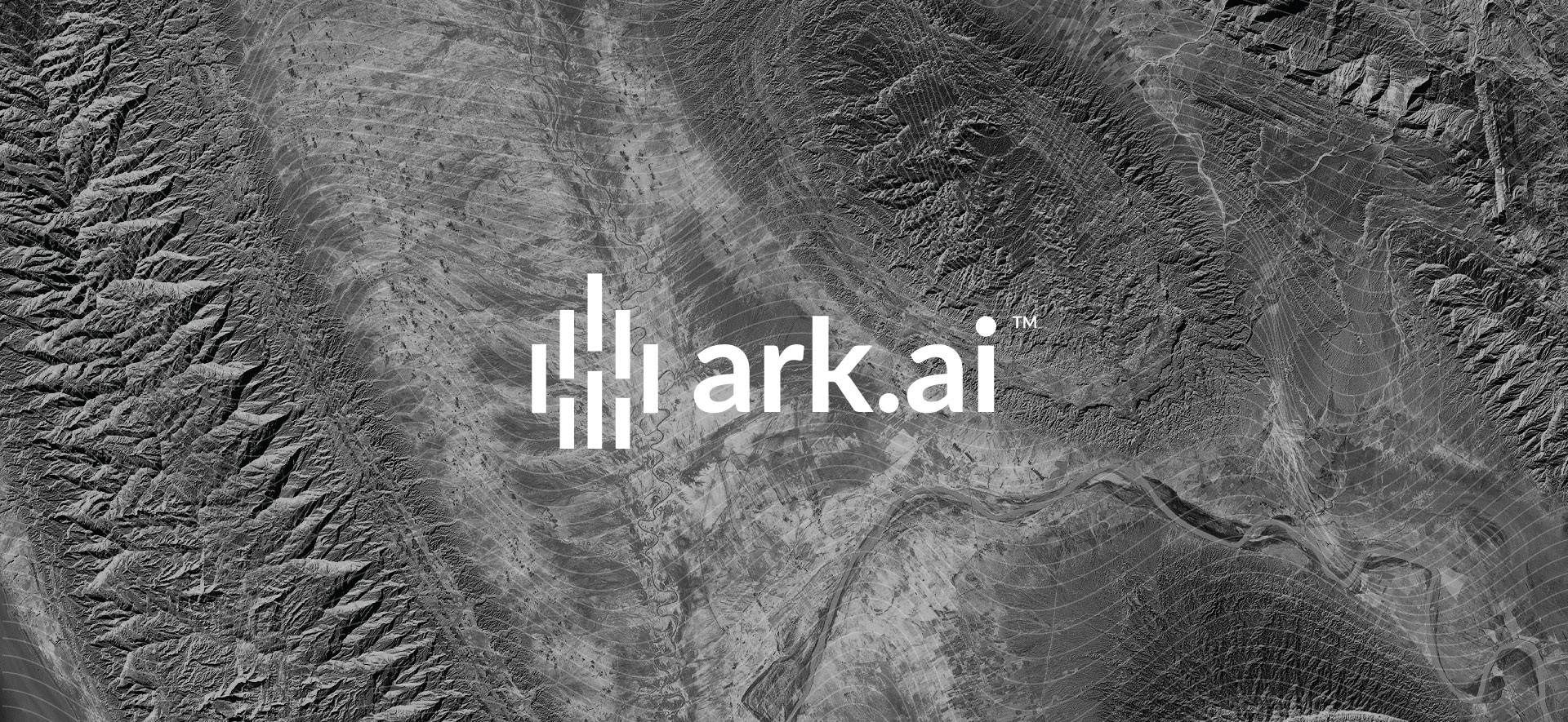 Ark.ai logo on top of an aerial land shot