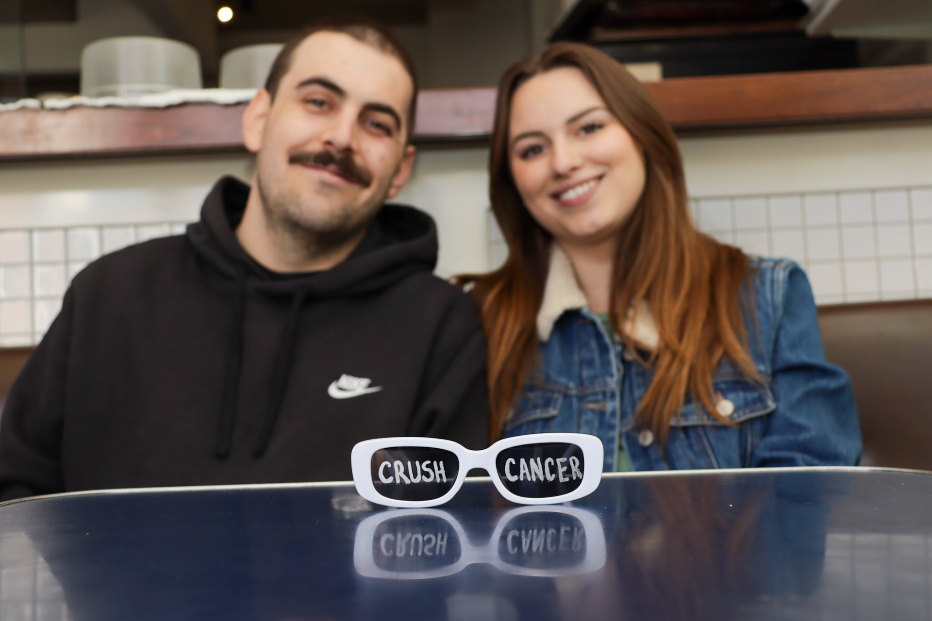 "Crush Cancer" glasses from their previous fundraiser event ran by Lauren Anderson and Geoff Boc to raise money for his brain cancer treatment on April 18, 2024 in Calgary, Alberta. Photo by Jenna Willox