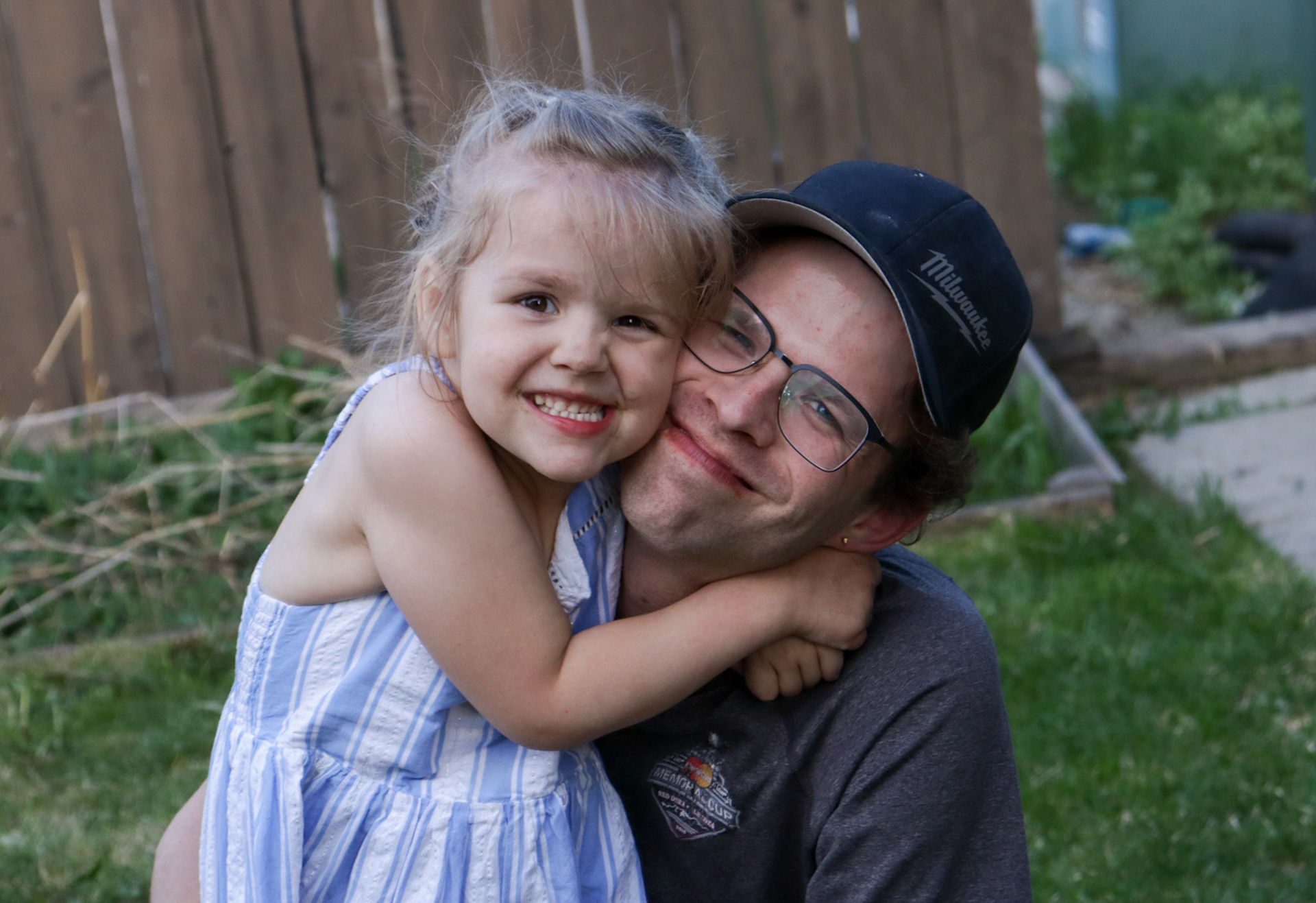 Gender fluid identifying Tom Swenson posing with his daughter Lucy as they navigate parenting outside of societal norms. (Photo By Jenna Willox)