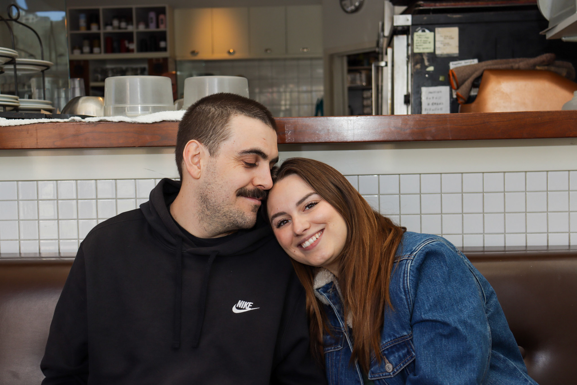 A sweet display of affection between couple Lauren Anderson and Geoff Boc on April 18, 2024 in Calgary, Alberta. Photo by Jenna Willox