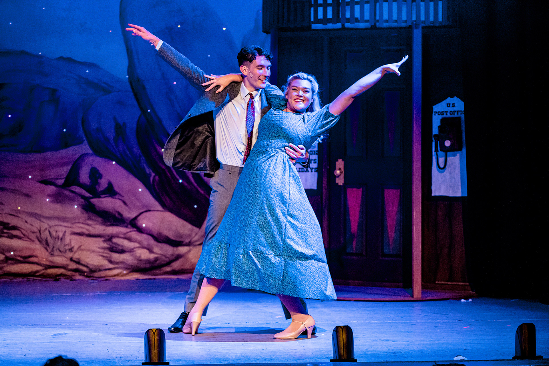 Bobby Child and Polly Baker dancing in each others arms with one arm each stretched behind them - Witham Amateur Operatic Society's "Crazy For You".