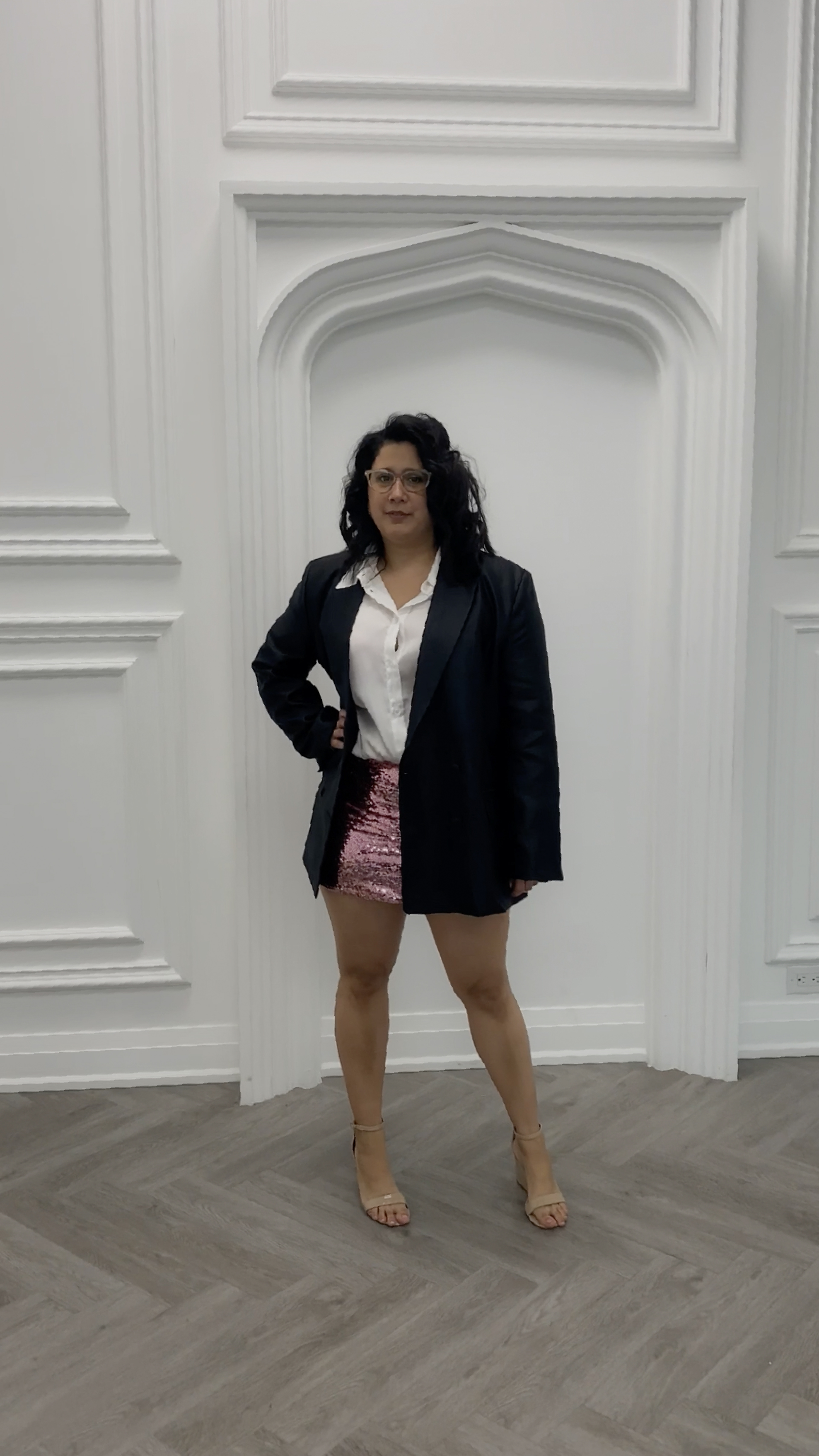 Crysbel Renoj Paxtor is posing for a brand photographer and publishing a video content that focuses on her entrepreneurship journey as a marketing manager for fashion brands.