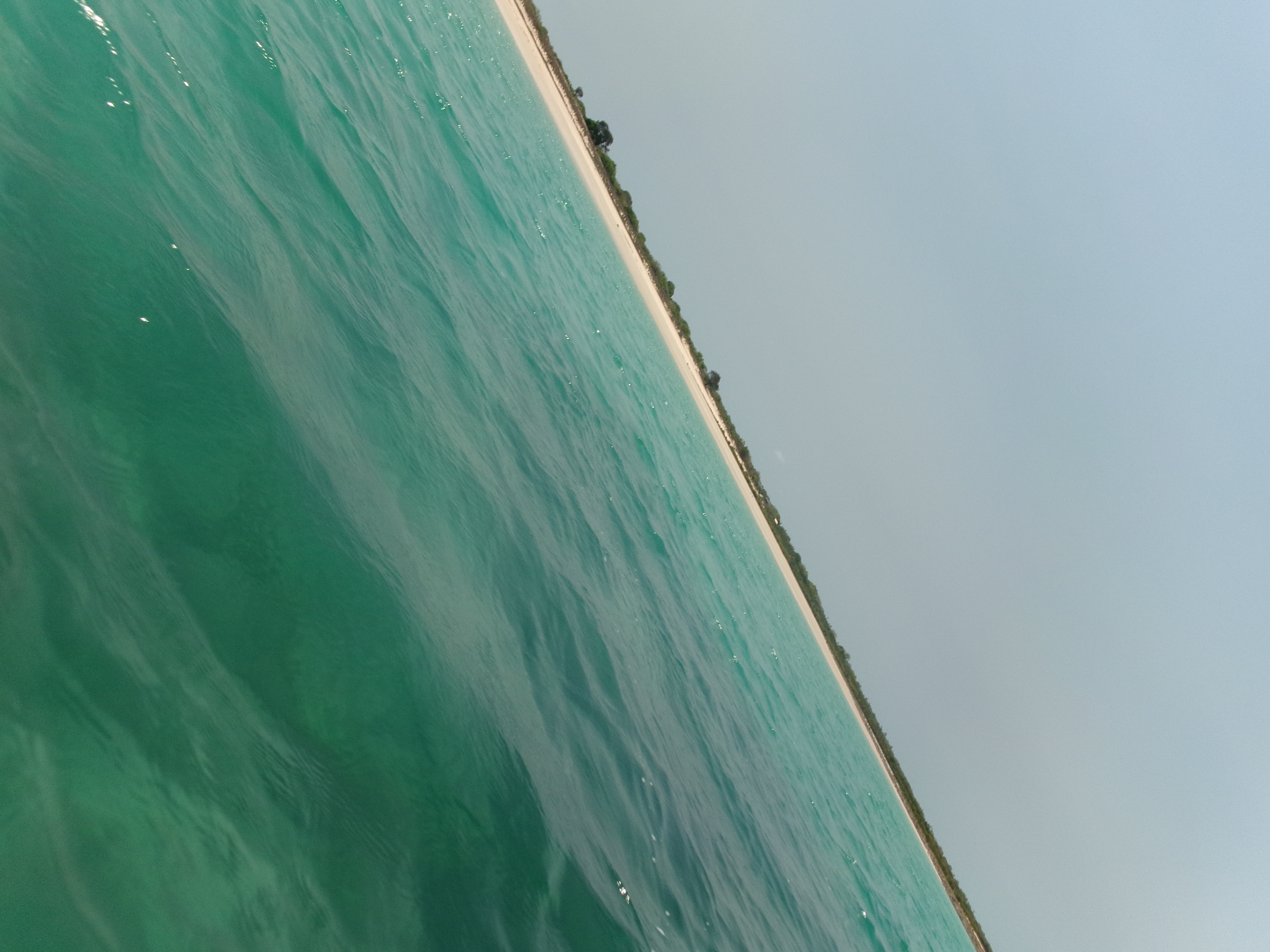 Jologo Beach. At first there's rocks but then it's sandy. Everytime we run around there on the sand. We get oysters. There's the first rock and then the sand and on the right there is the oysters. We crack them from the side with a rock or a hammer. © Zharni 2023