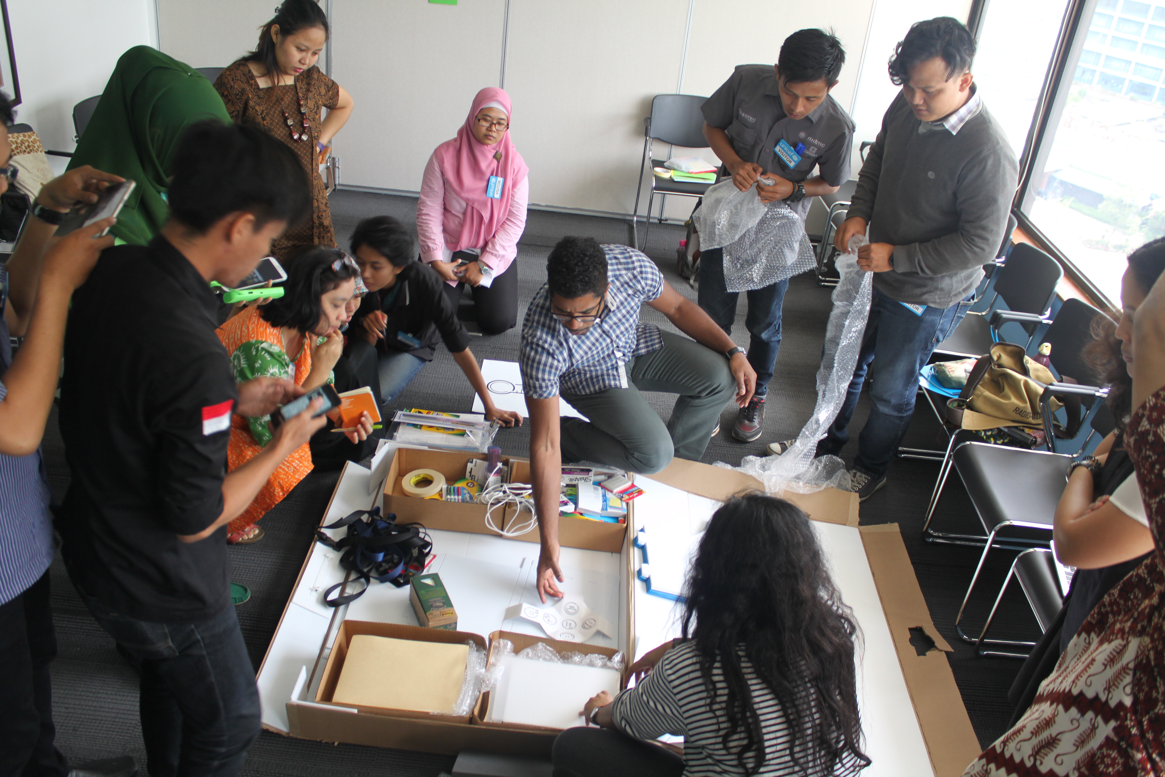 Introducing Indonesian facilitators to the advanced kit prototype.