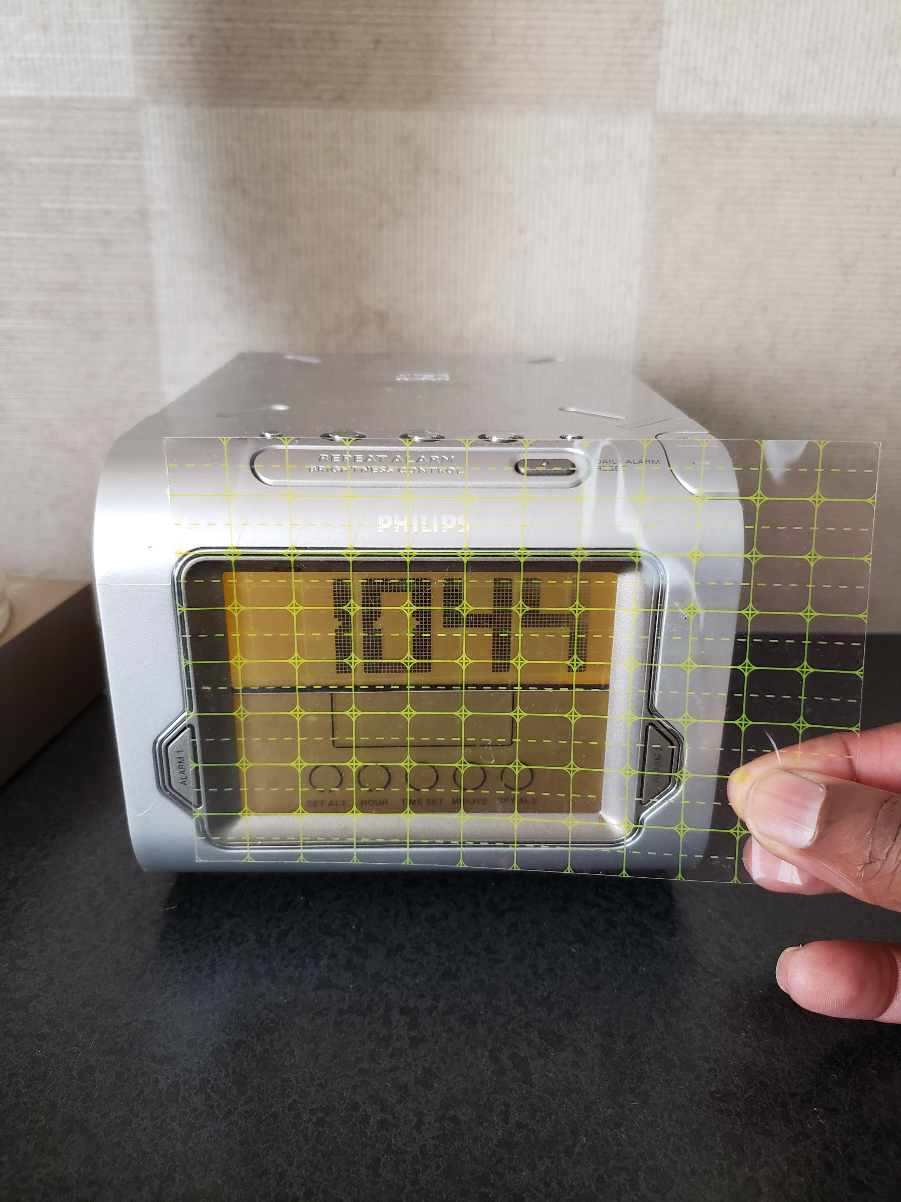 User-testing: Testing cutting guide on hotel clock.