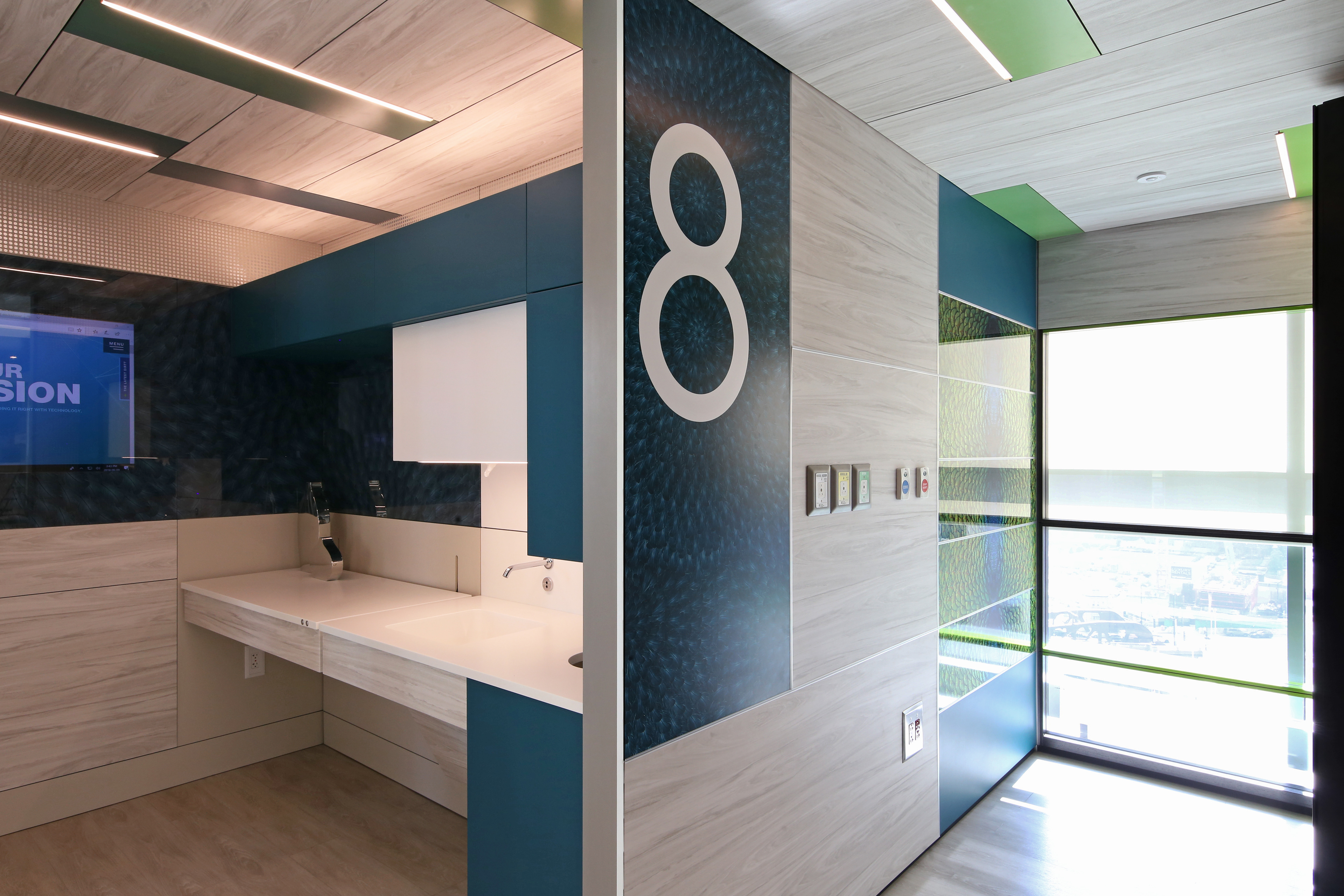 Glass to the left and the room number graphic were made by duplicating feathers to form repeating circles.