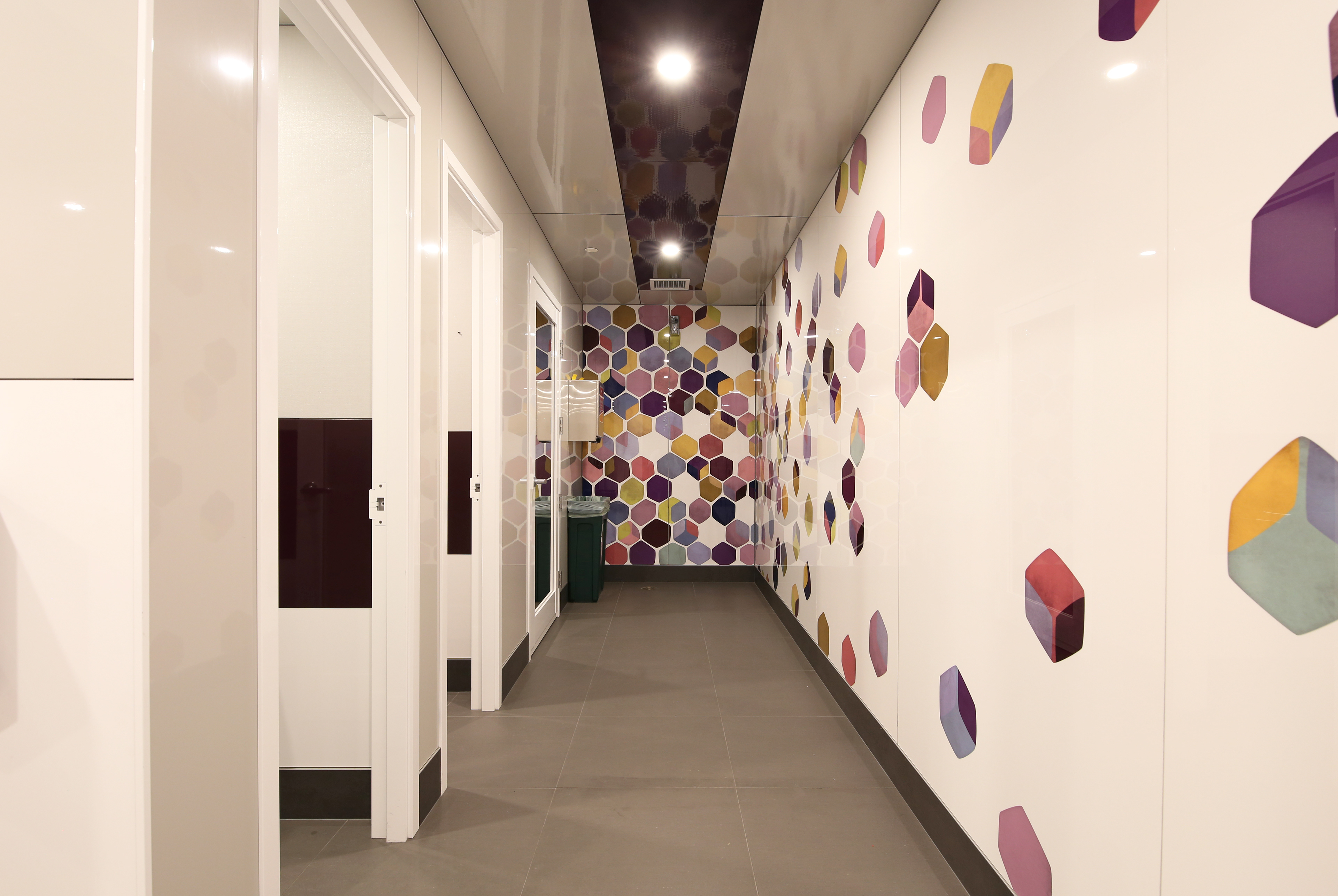 Fun and vibrant bathroom graphics.