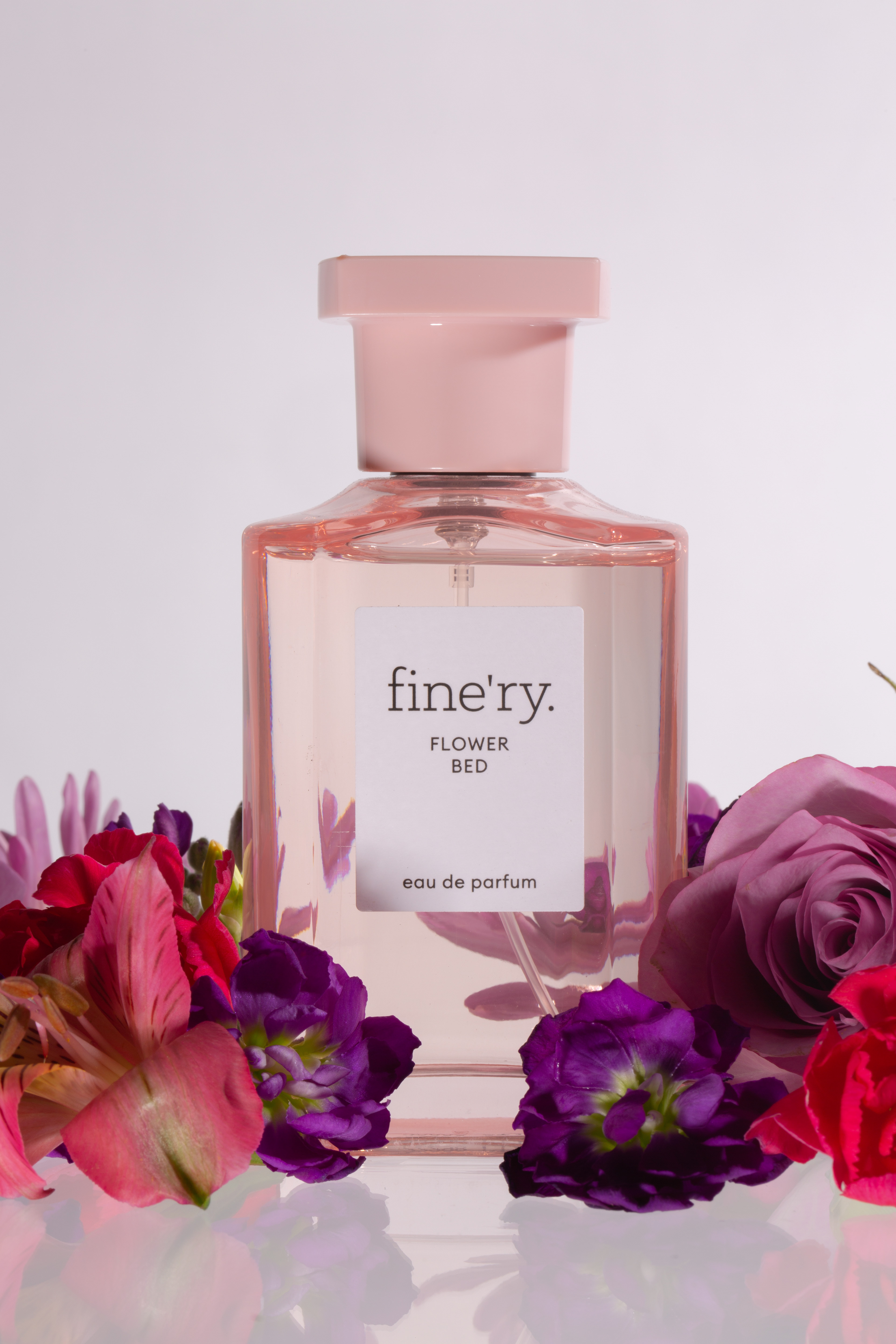 Photograph a bottle of perfume for a Macy's ad either high-key or lowkey.
