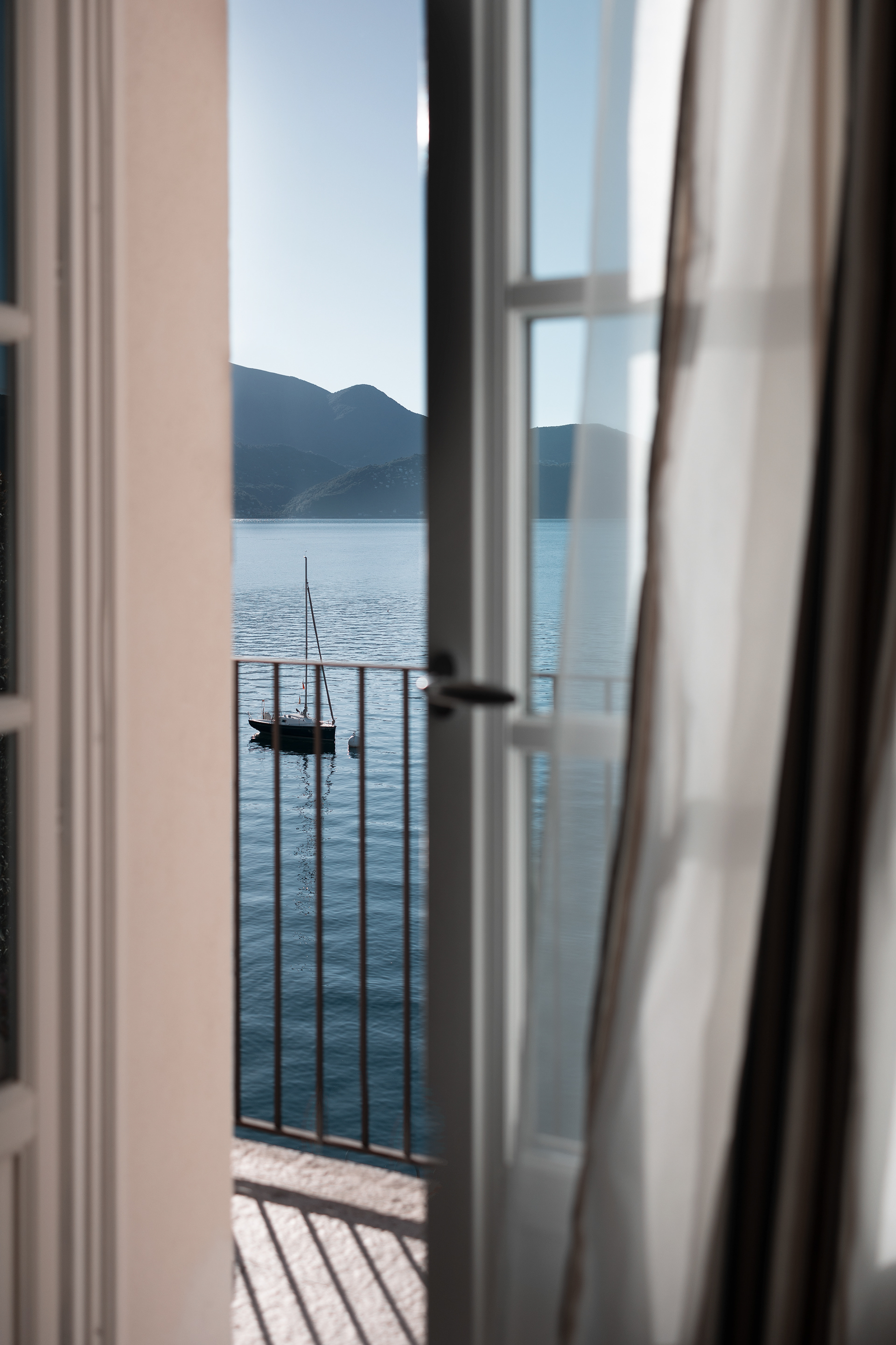 impressive lake view from the window, lago maggiore in the morning by photographer Claudia Bonazzi