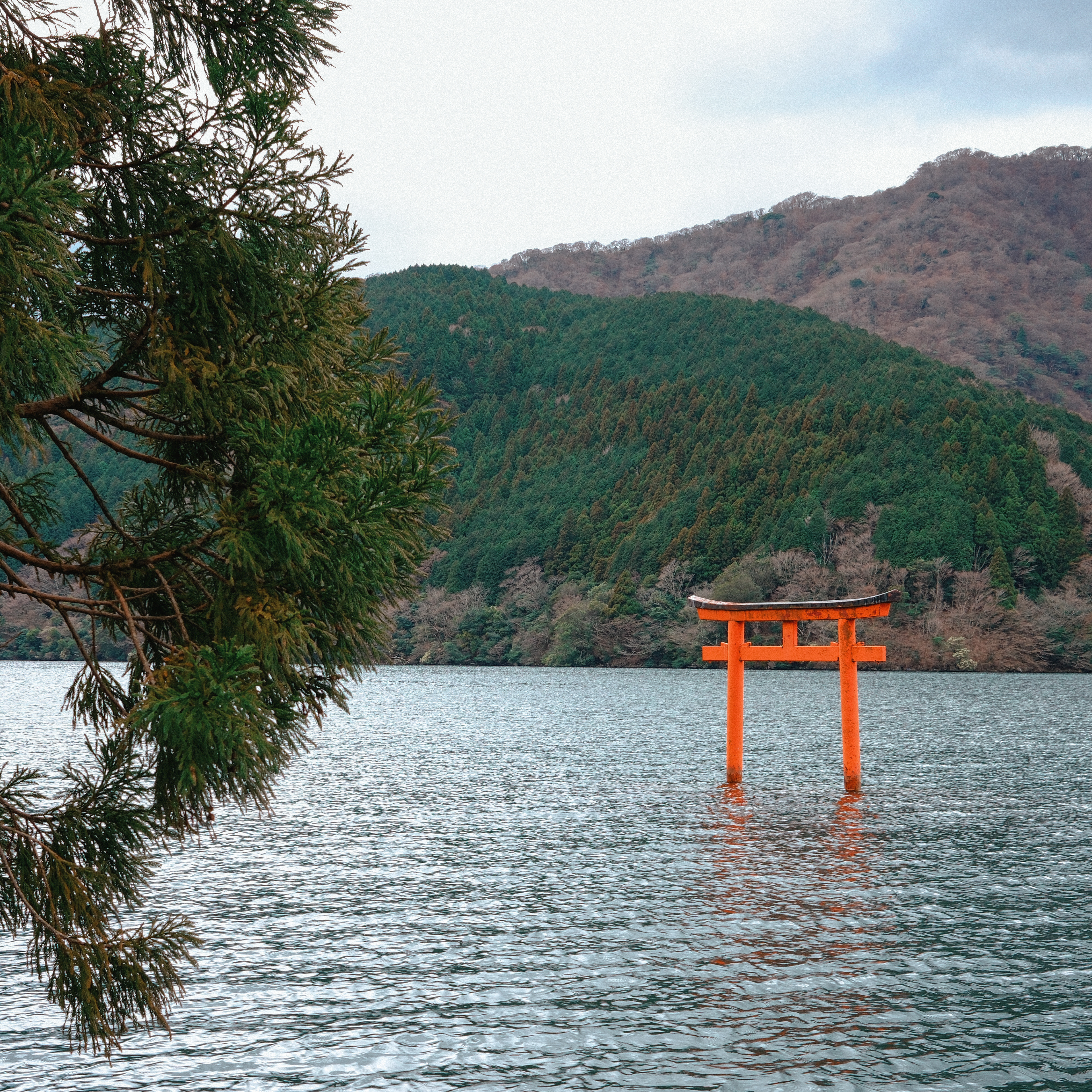 hakone lake in japan with red shrine, photo with fujifilm x100vi