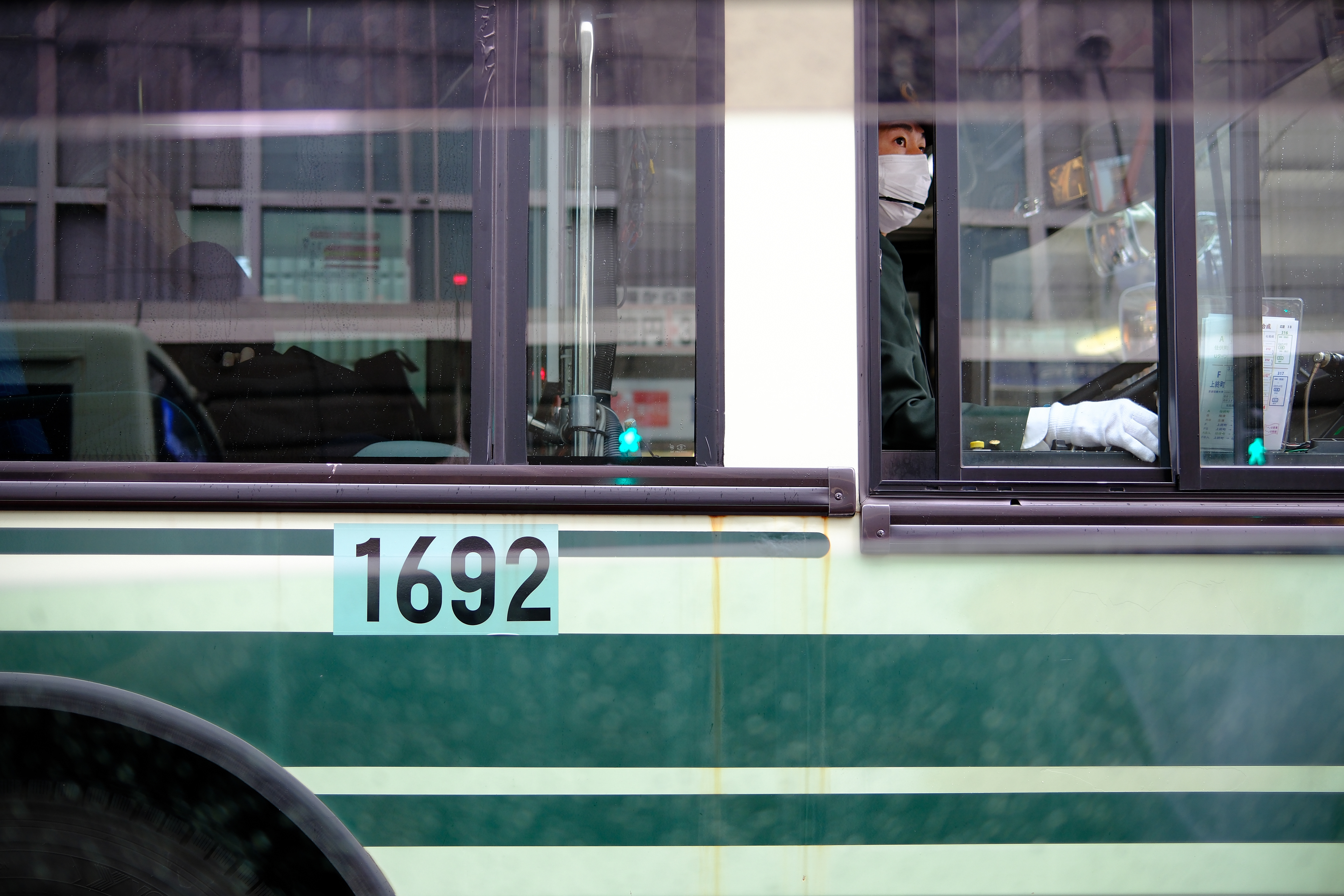 kyoto, bus driver in kyoto, green bus in kyoto