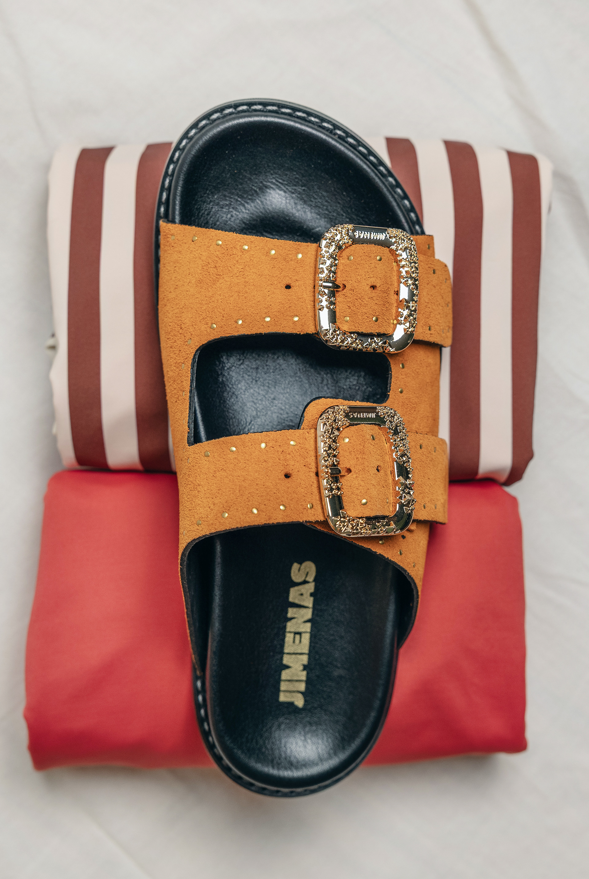 still life photography with minimal estetic, with sandals by Jimenas and Van swimwear