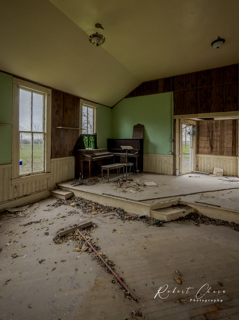 In a dark dusty roomMusty smell in the airWarm sound of the musicRising up through the airUp ahead in the cornerI saw a shimmering lightMy head grew heavy and my sight grew dimI had to stop for the light