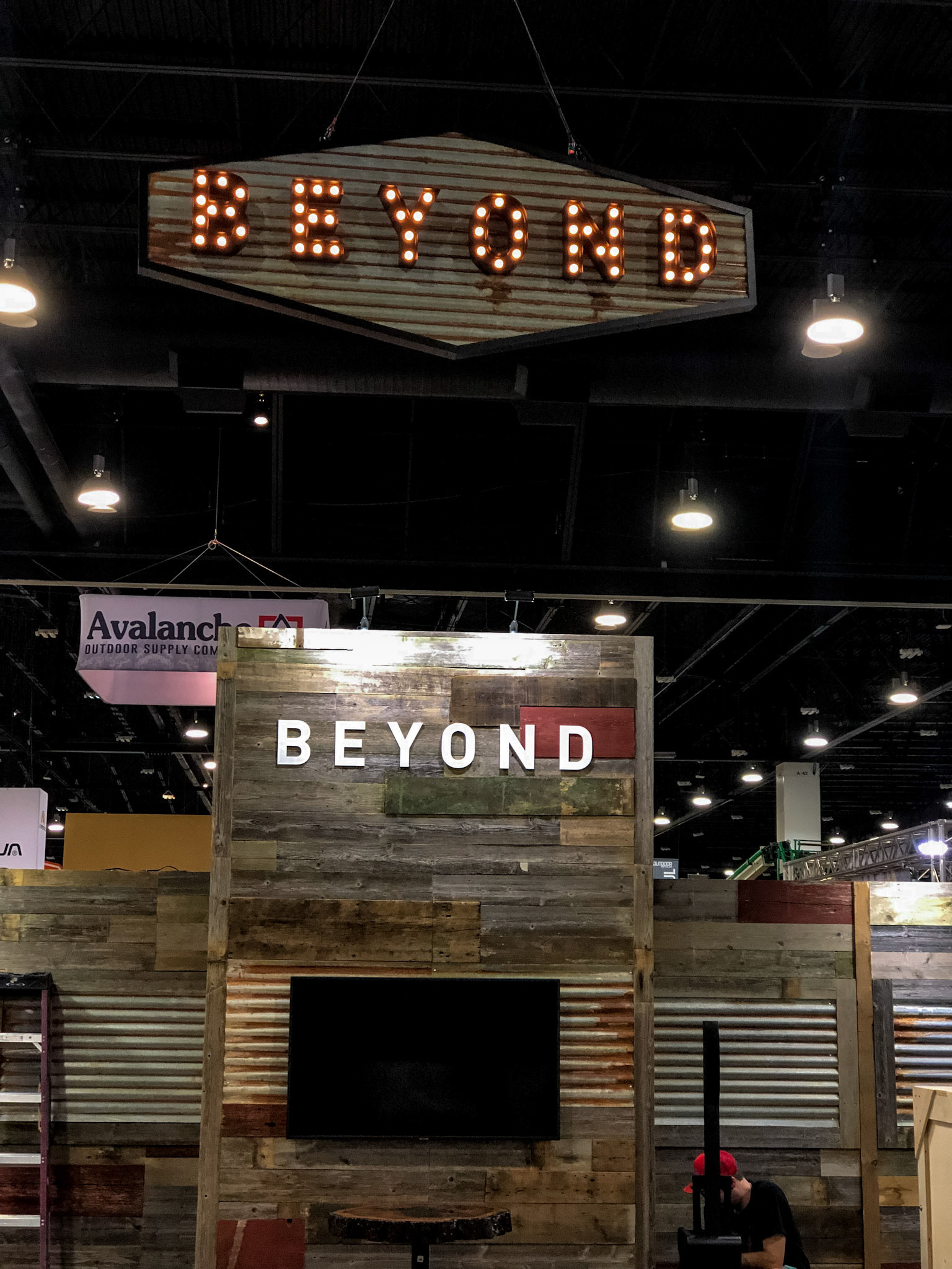 The large, vintage rotating lit sign stands out amongst the others.