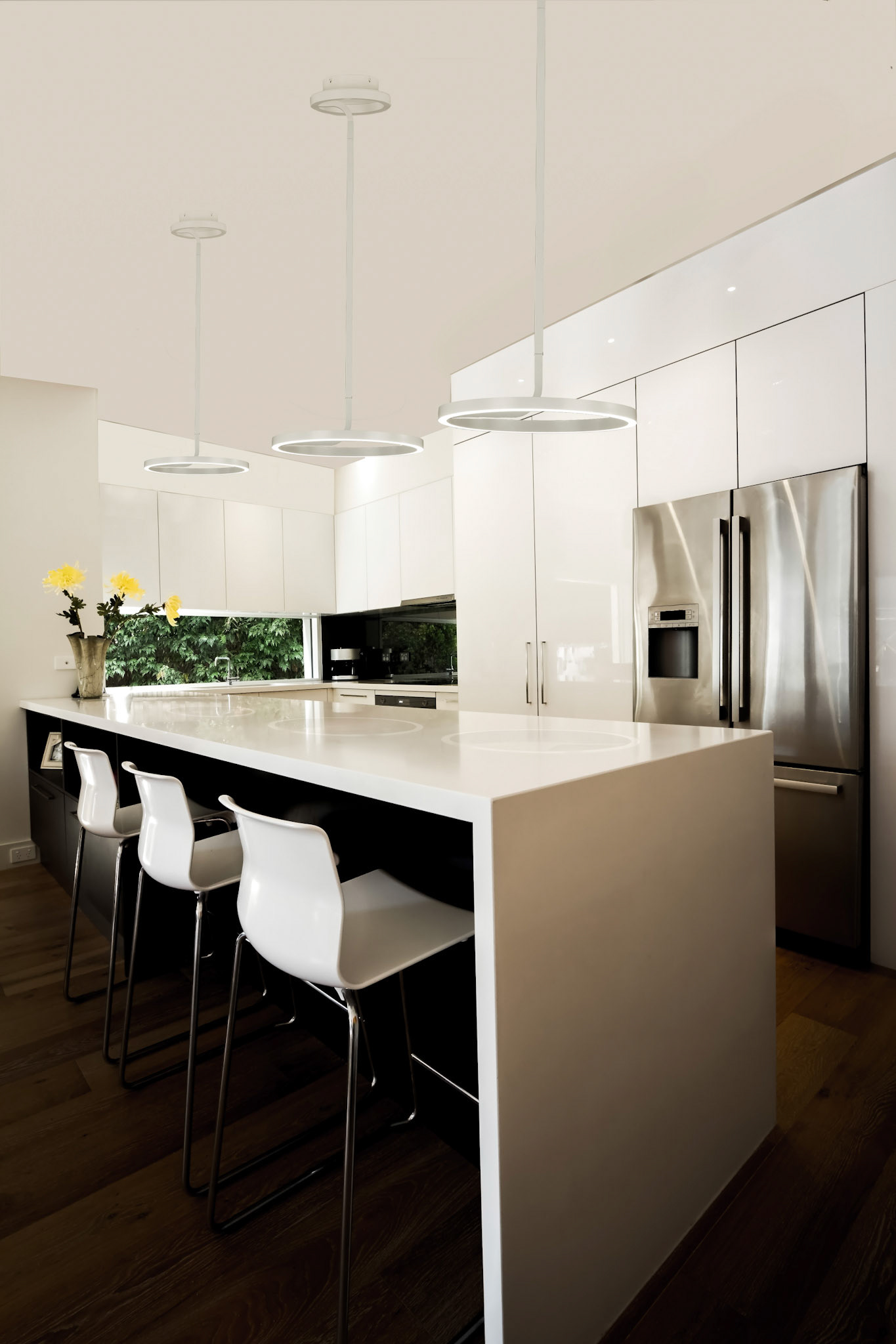Modern Australian kitchen renovation with waterfall stone island bench