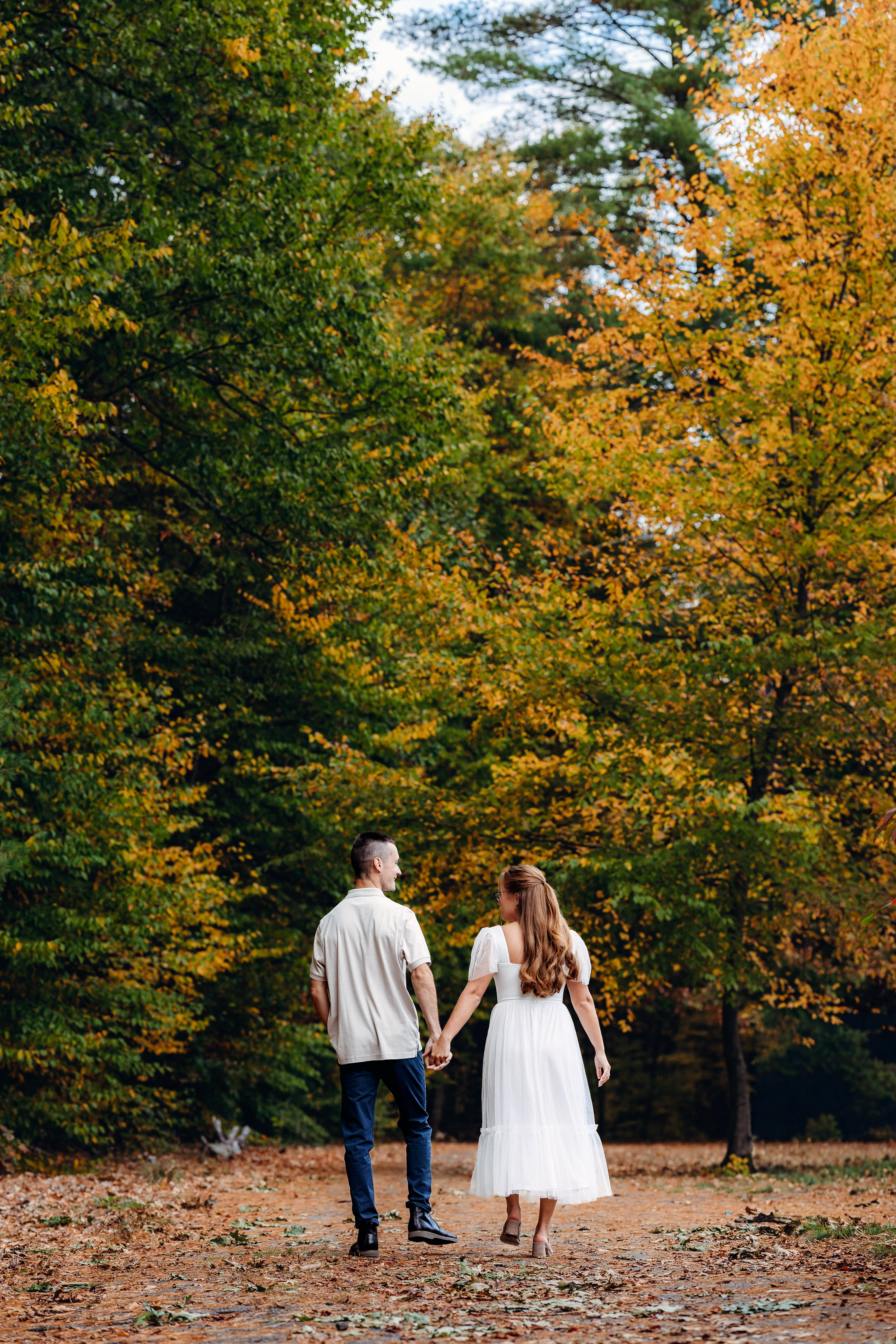A walk through autumn woods, hand in hand, just being themselves.