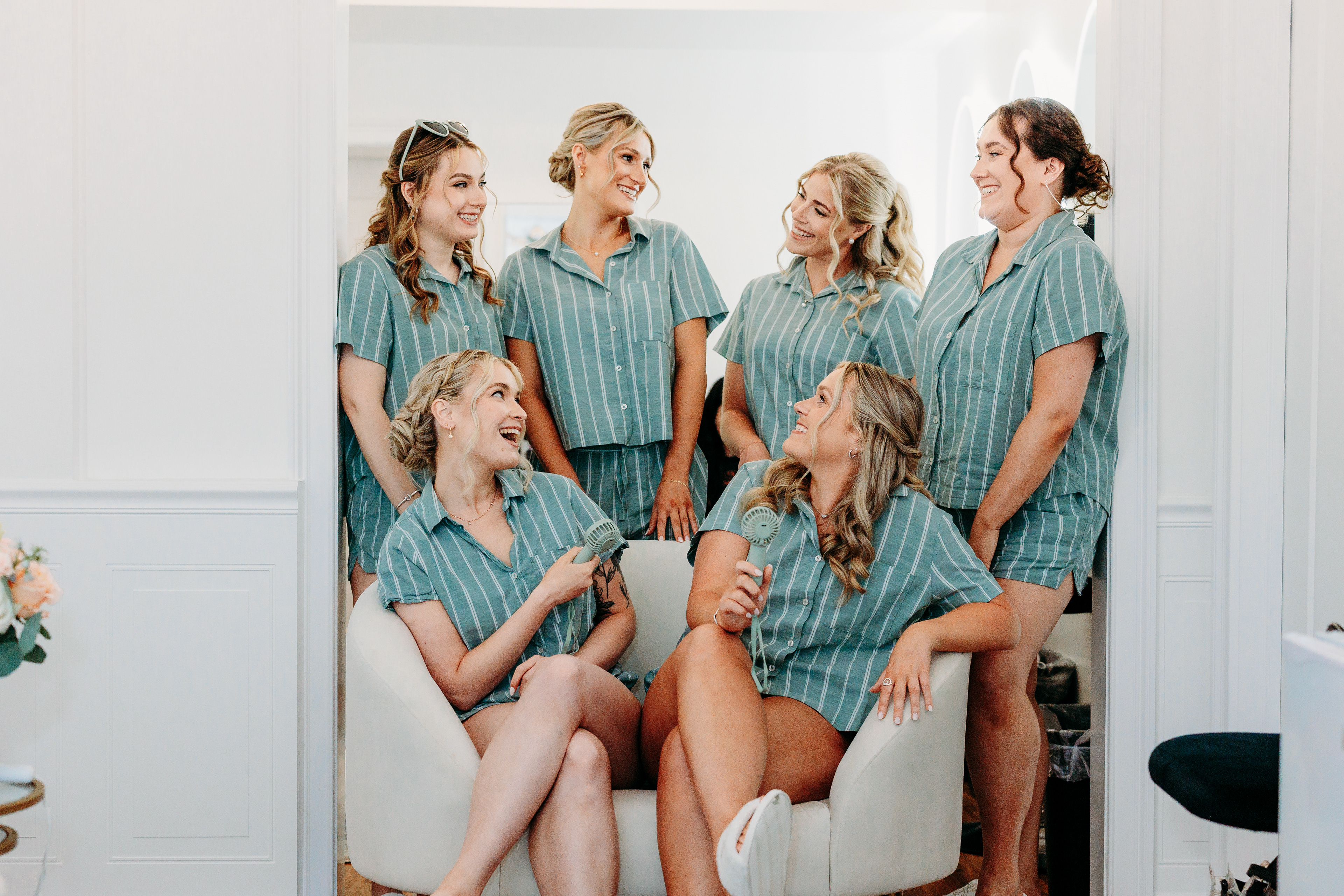 Candid moments while getting ready — laughter, coffee, and a touch of nerves before the lakeside ceremony.