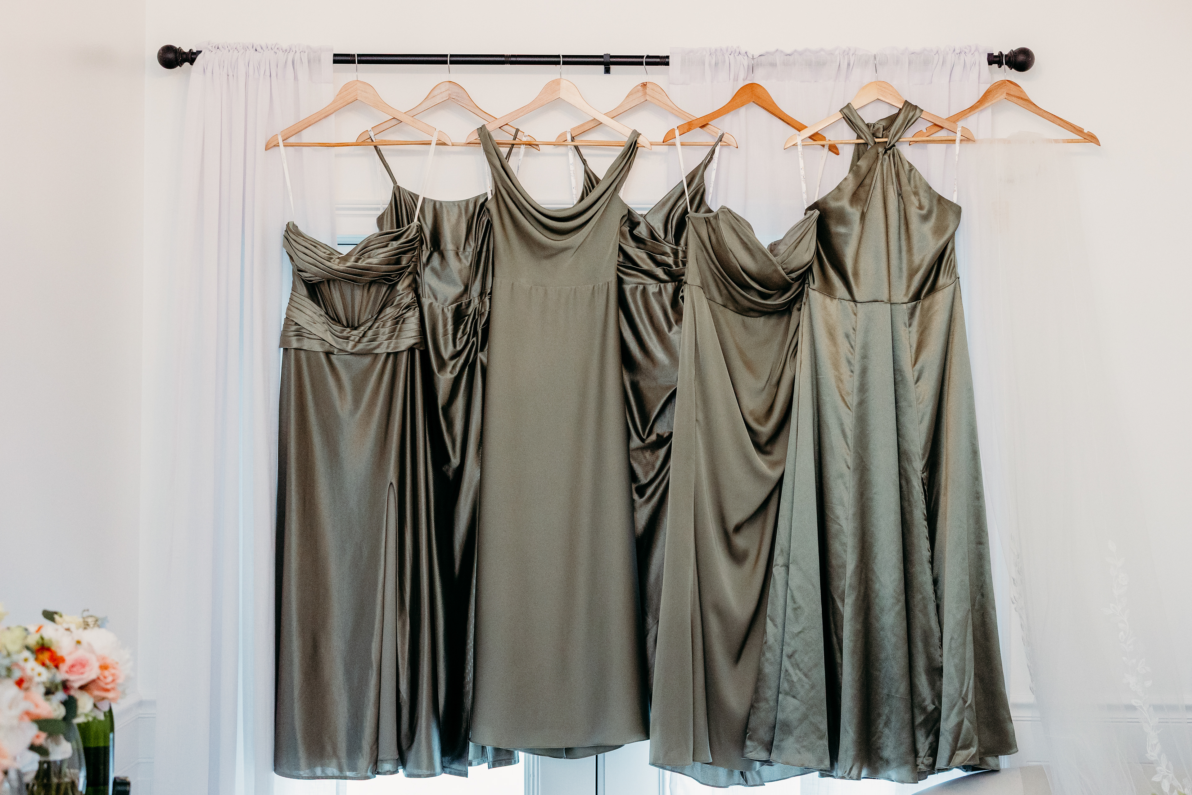 “Bridesmaids’ dresses in blush and blue, swaying gently in the morning light at Indian Head Resort — New Hampshire weddings are all about these little moments of beauty.”