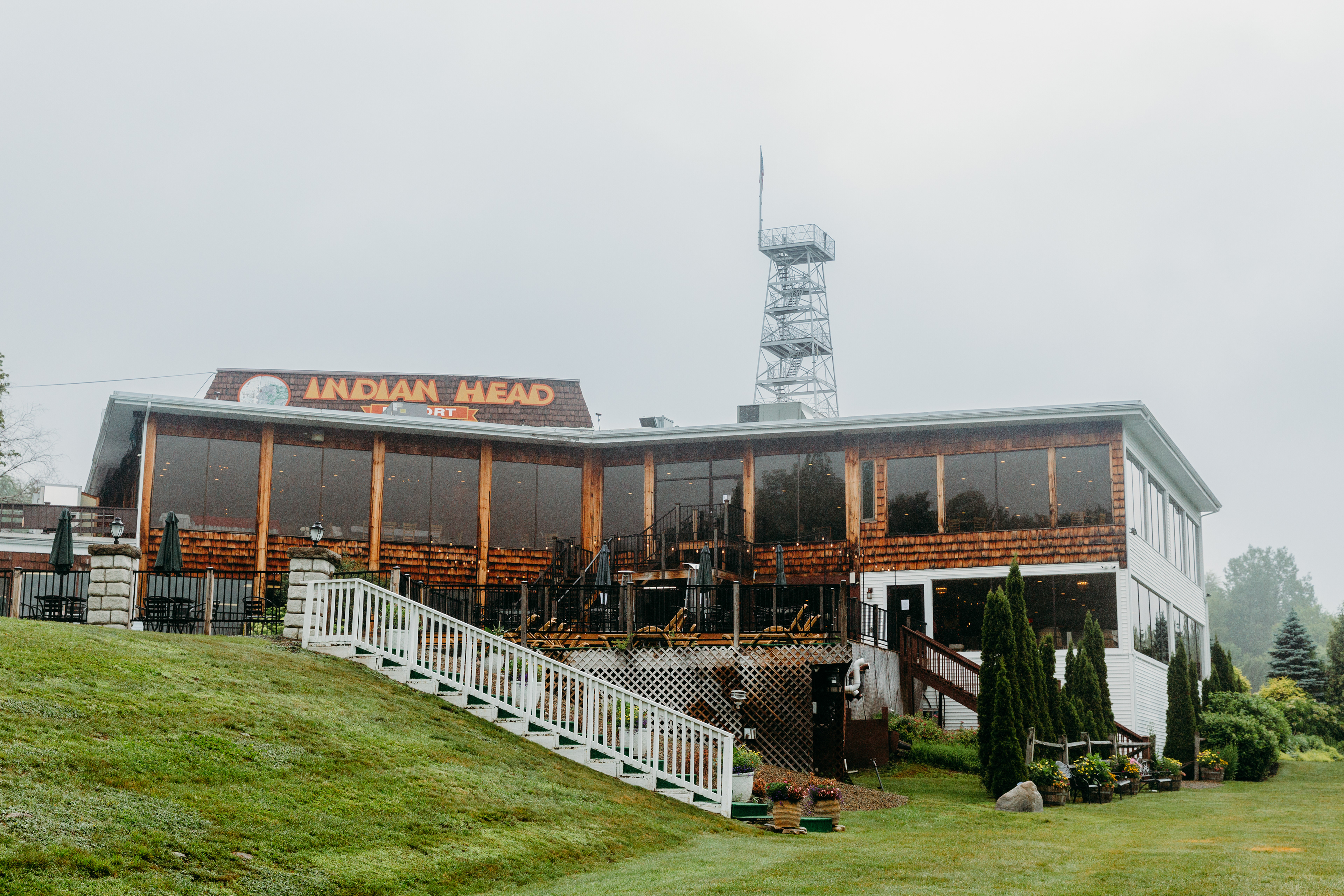 A peaceful morning at Indian Head Resort — mountains watching, florals swaying, love waiting to begin.