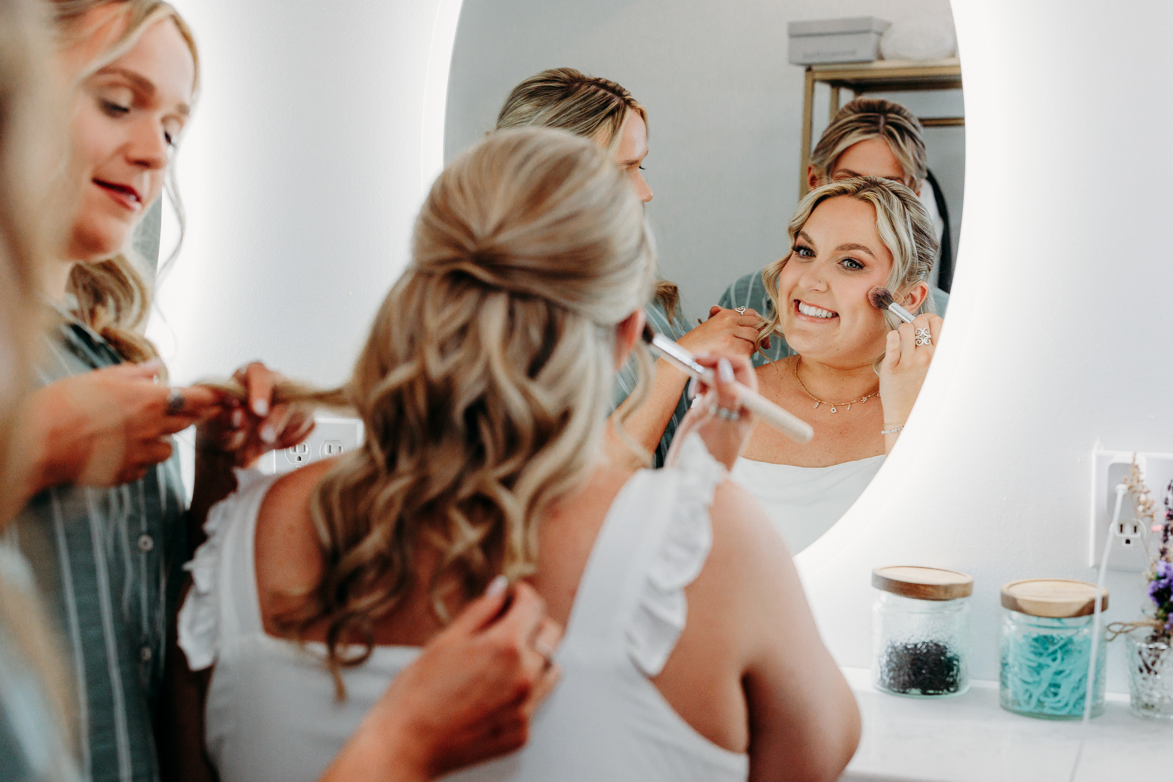 Morning light, laughter, and lace — a bride surrounded by her sisters and closest friends at Indian Head Resort, New Hampshire.