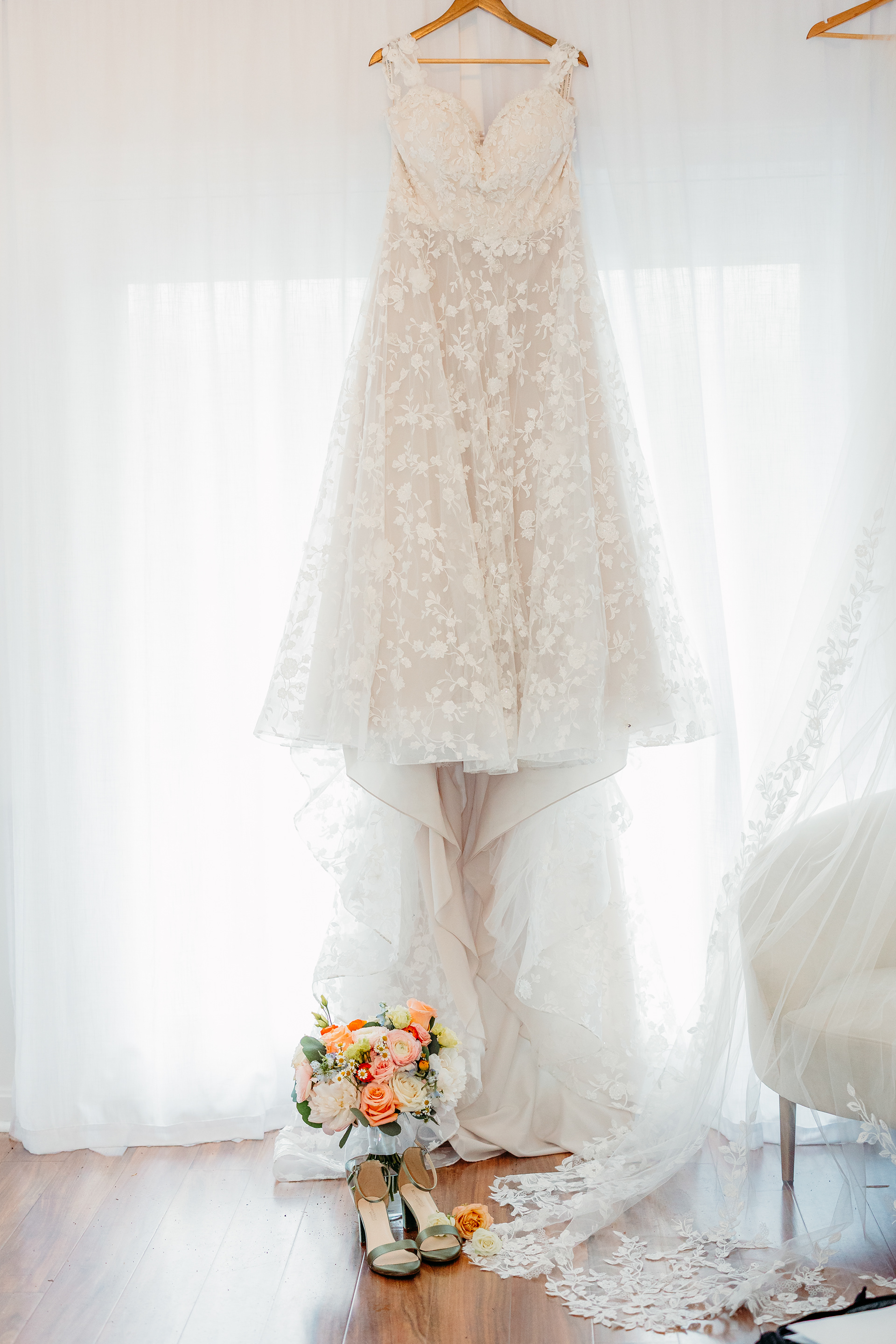 Elegant flat lay of the bride’s shoes and florals — photographed at Indian Head Resort in the heart of the White Mountains.