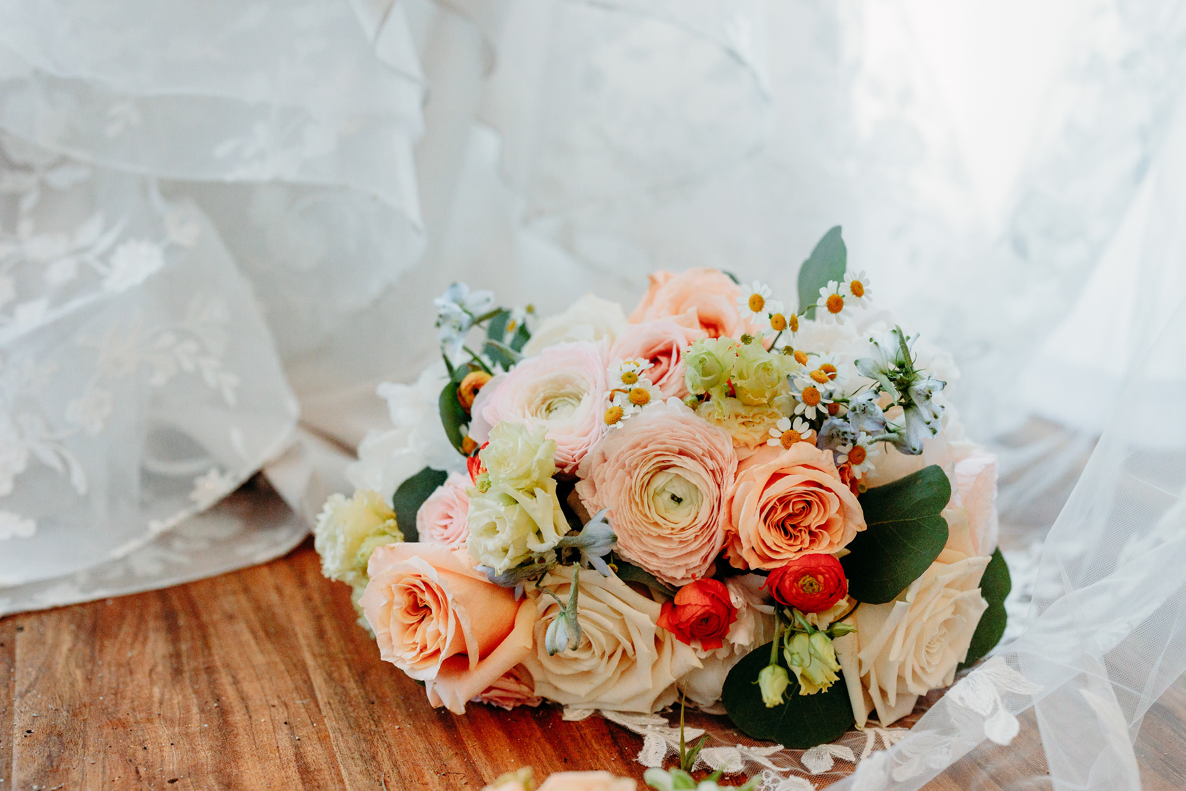 Handcrafted bouquet by FERN Floral — natural textures and soft summer hues for this Indian Head Resort wedding.
